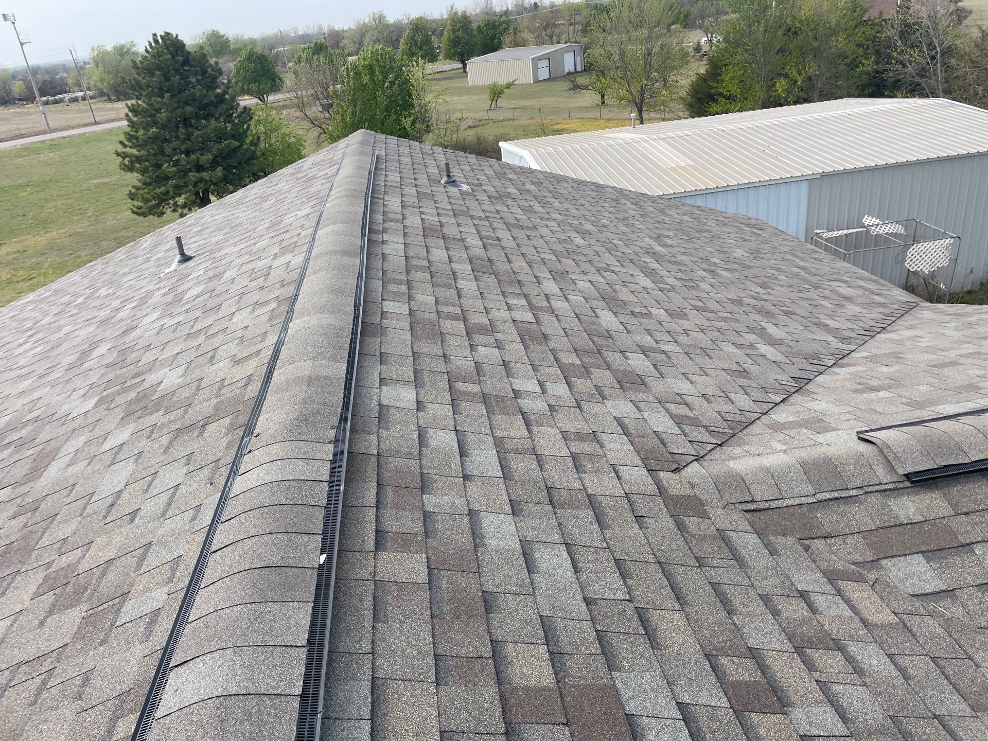 Roof Siding & Window Project in Mustang, OK by Z Construction & Roofing, LLC