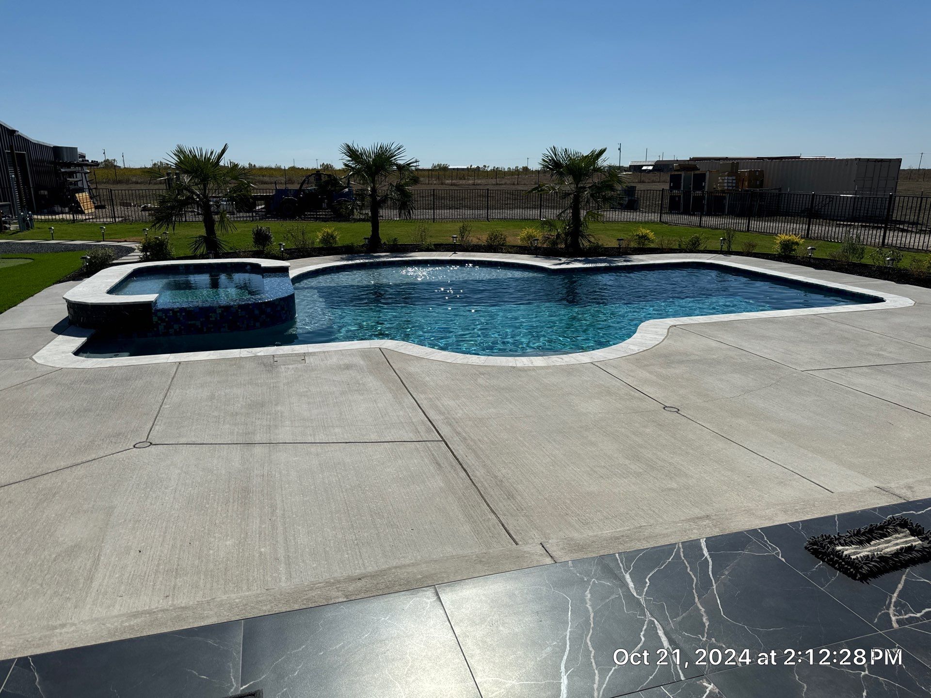 Freeform Pool with Raised Spa by Pinnacle Pools and Spas - DFW