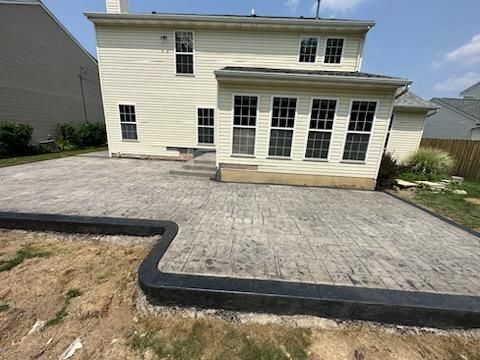 Stamped Concrete, Entry Door, and Concrete  by Ivy Lea Construction