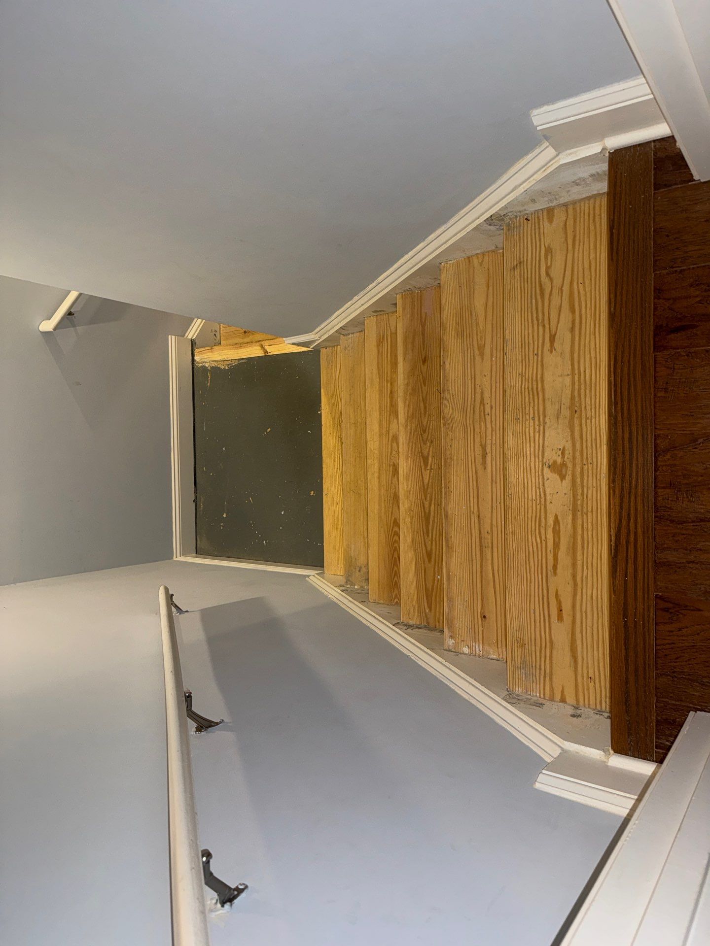 Stairway Installation using t vinyl stair tread and reversibleriser by La Bendicion Contruction Llc