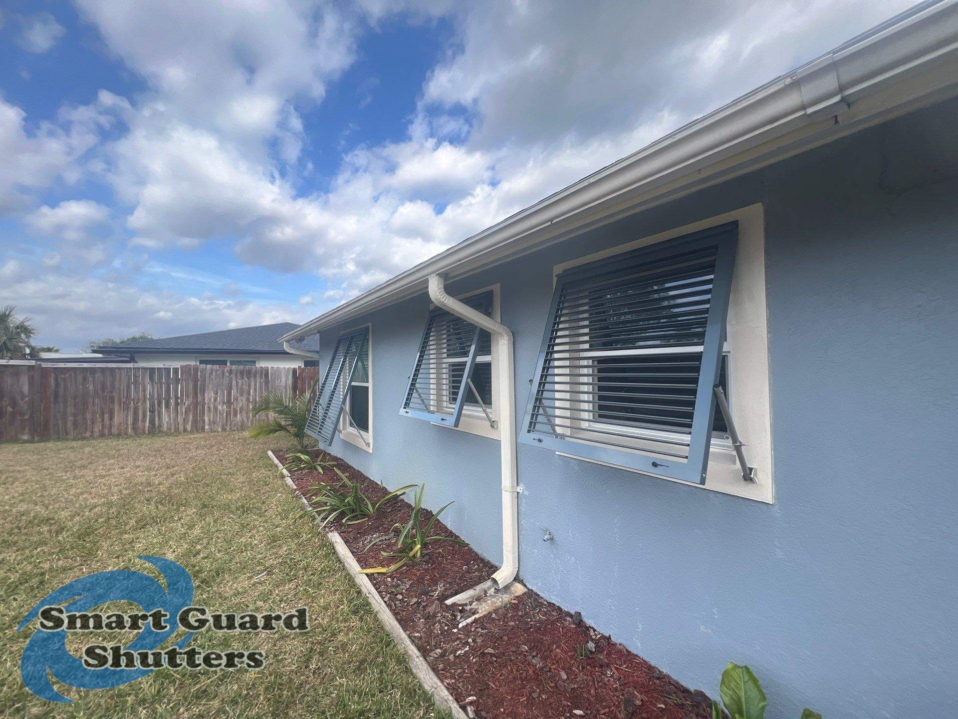 Hurricane Protection in Blue Grey by Smart Guard Shutters