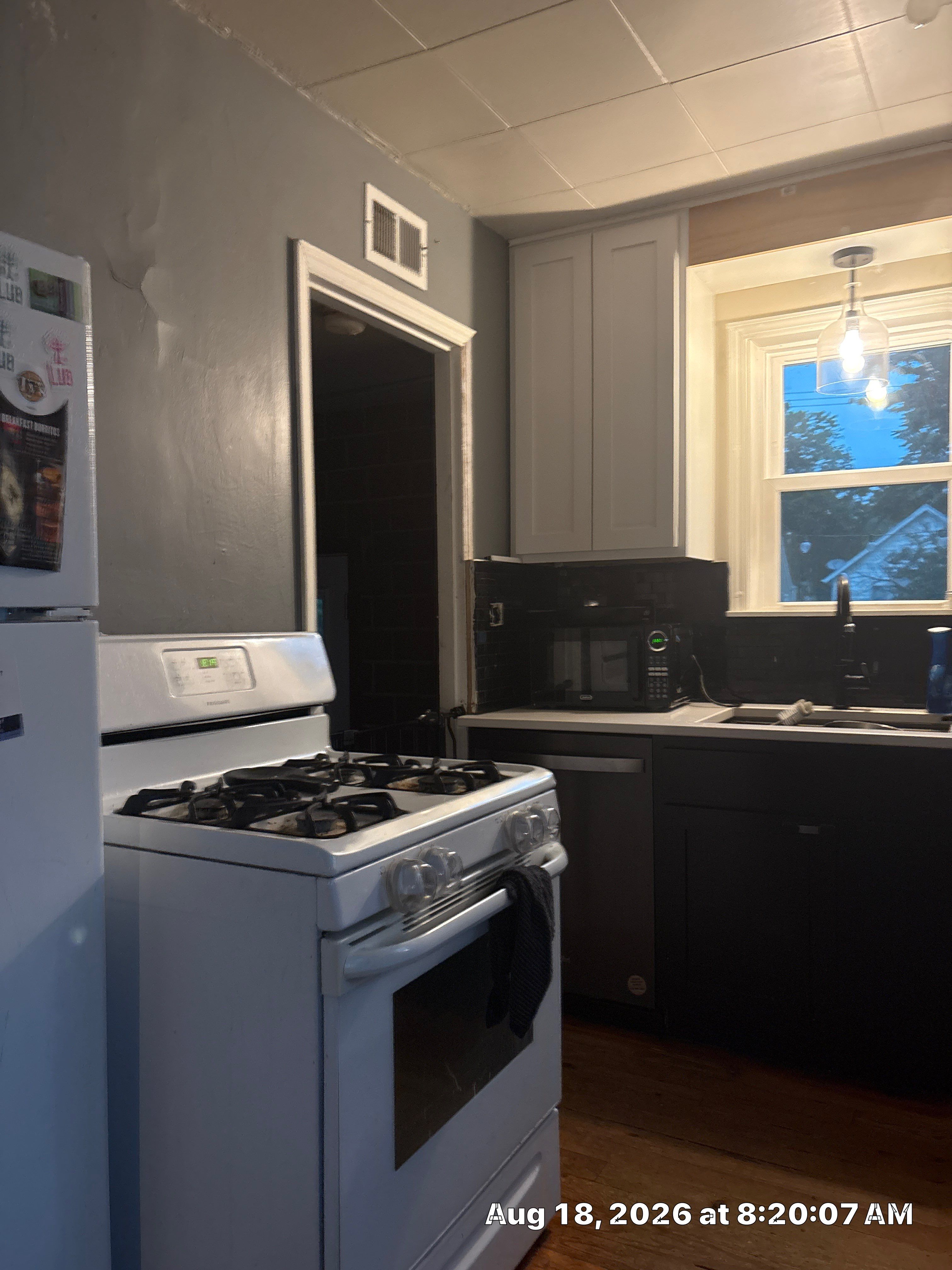 Lincoln Kitchen Renovation Featuring Black and White Shaker Cabinetry by CompanyCam Sales Demo