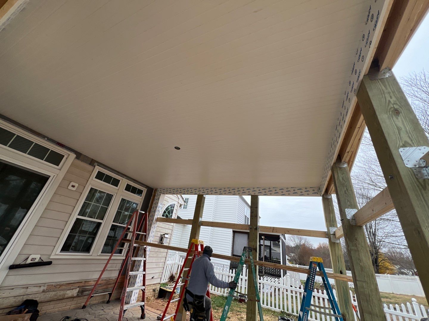 Custom Screened-In Porch with Stamped Concrete Patio in Warrenton by Jakari Restoration & Construction LLC