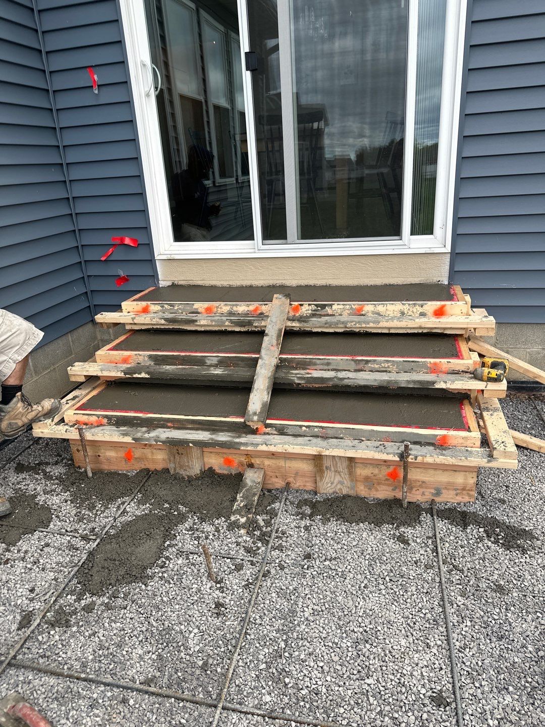 Majestic Ashlar stamped concrete patio with rock face steps  by NG Masonry & Construction LLC