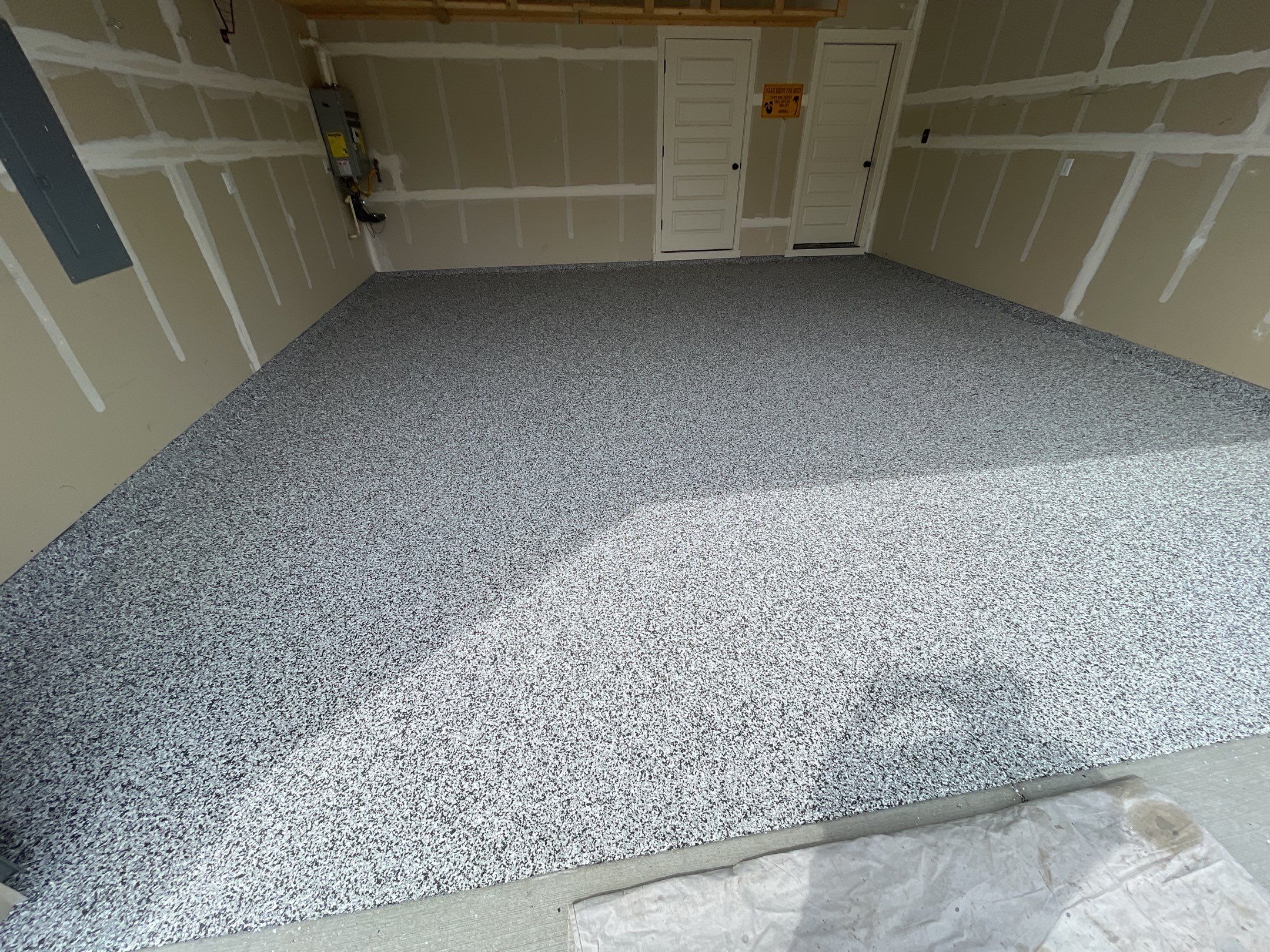 Garage Transformation using Domino by Croc Coatings, LLC