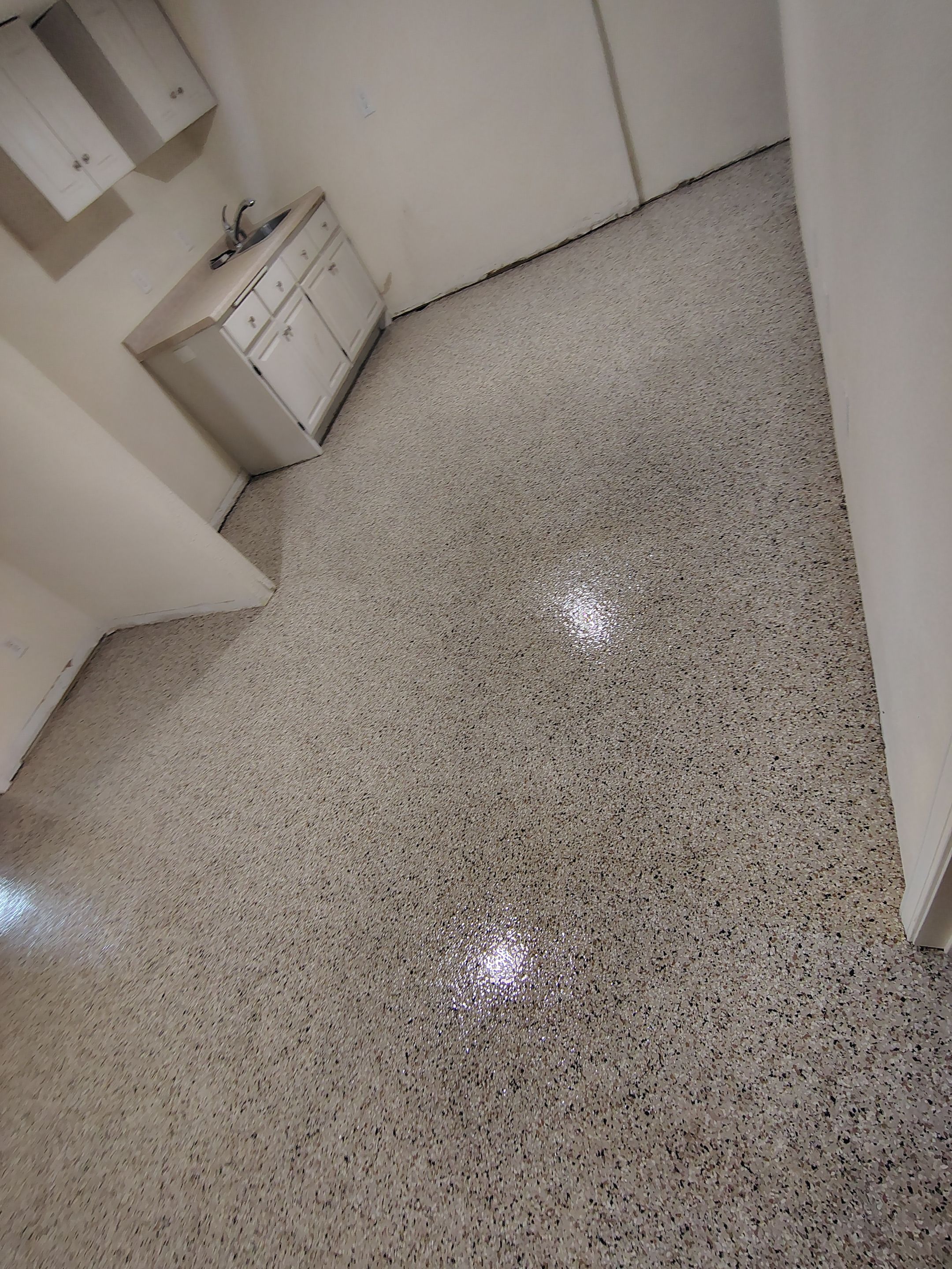 Comprehensive Basement Concrete Floor Coating and Crack Repair in Sioux Falls by Select Painting, Coatings & Garage Cabinets