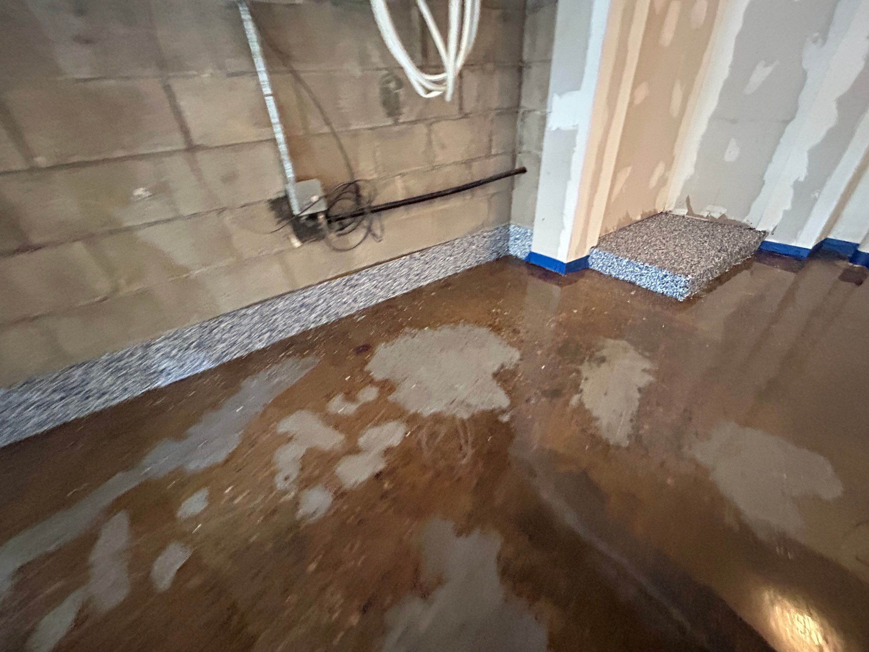 Garage Concrete Floor Coating Transformation by DiGiorgi Roofing and Siding Inc