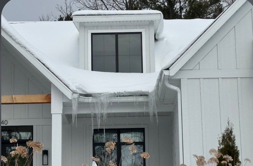 Residential Ice Dam Removal in Traverse City by Rainbow Seamless Systems
