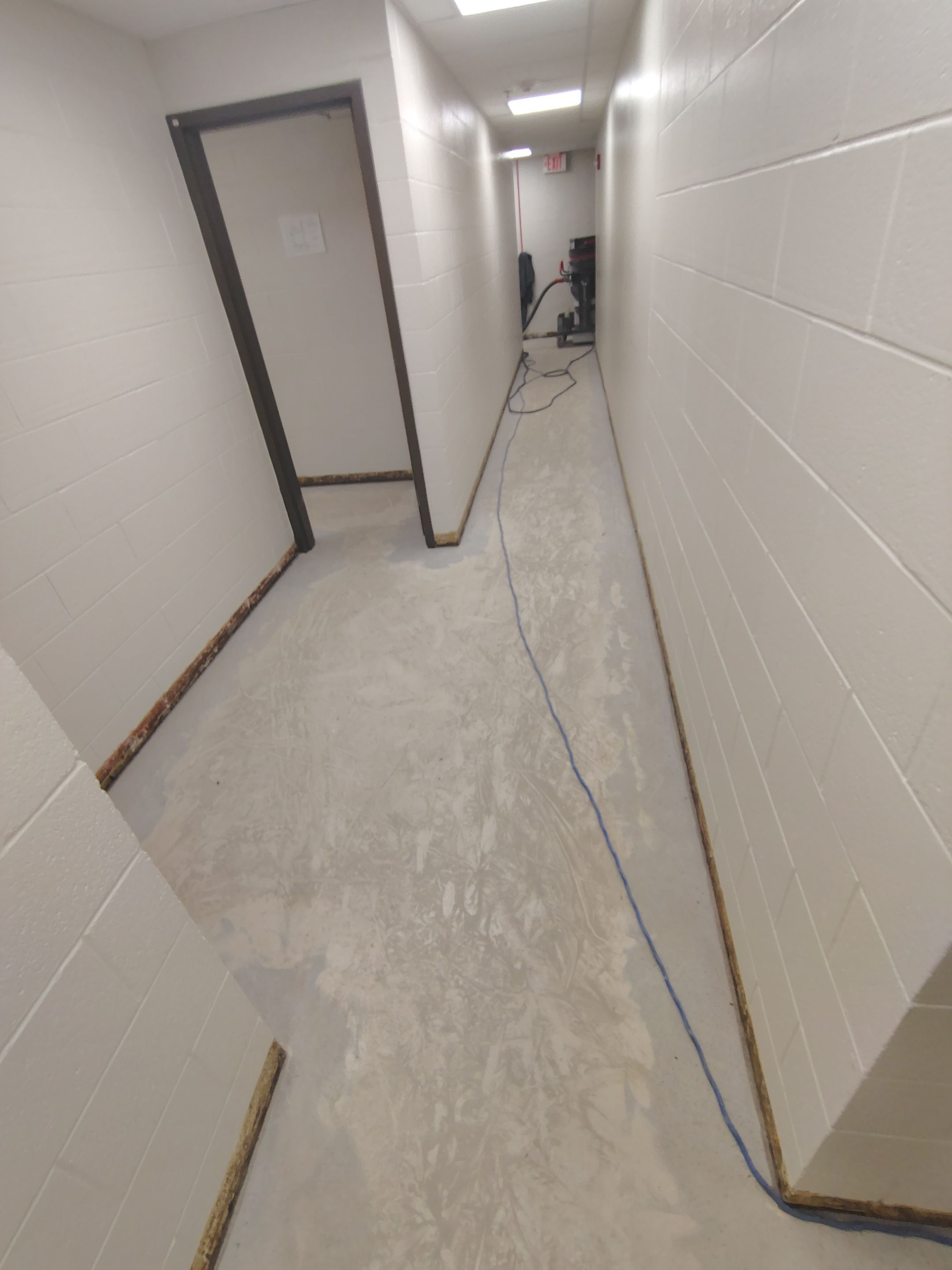 Industrial Flake Epoxy Floor Installation at Pierre National Guard Facility by Select Painting, Coatings & Garage Cabinets