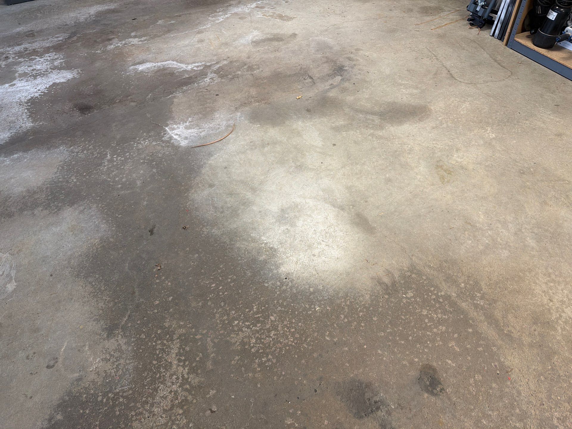 Feather Grey Garage Floor Coating Installation in Sioux Falls by Select Painting, Coatings & Garage Cabinets