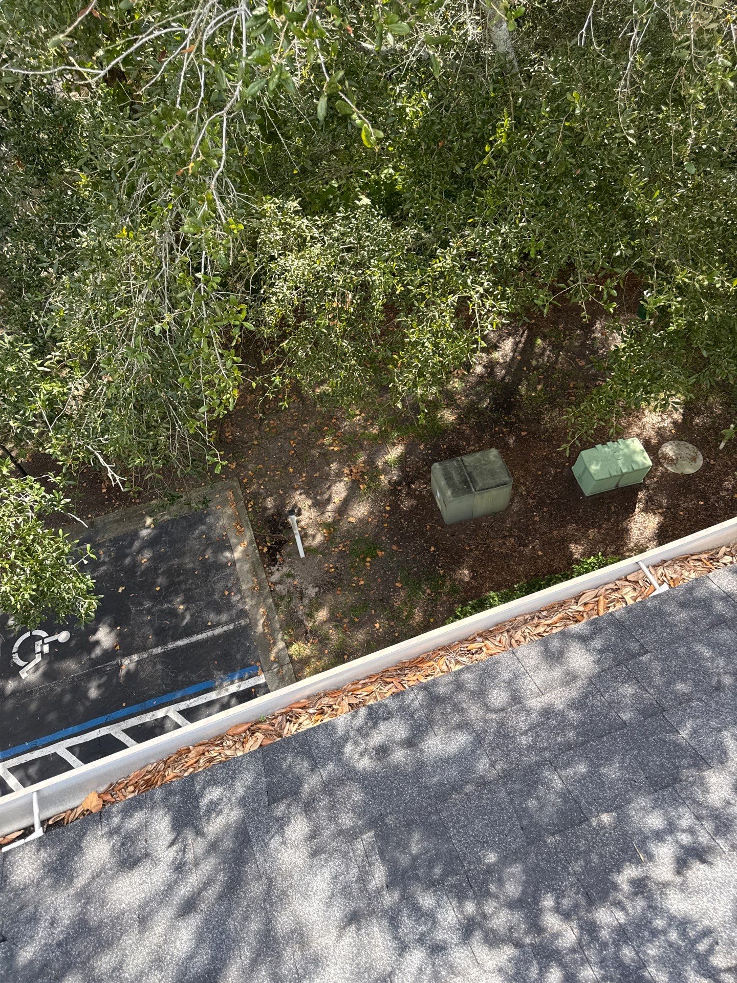 HOA gutter cleaning in St. Johns County & Ponte Vedra, FL,before photo showing full gutters.