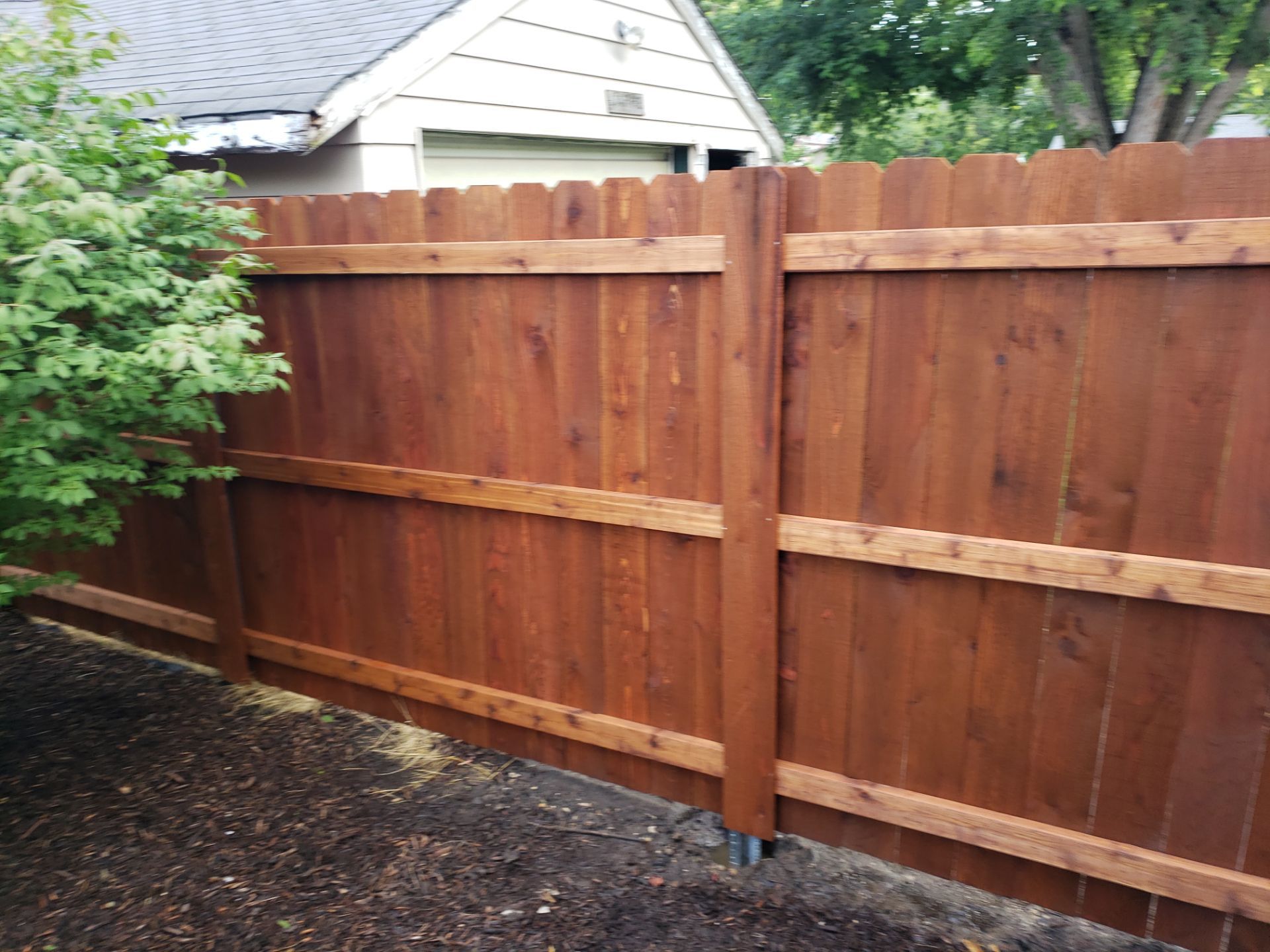 Custom Chestnut Stained Cedar Privacy Fence in Waterloo by Perfect Picket Fence and Stain