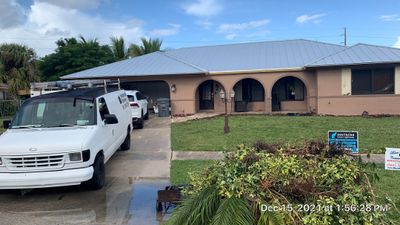 Residential Roofing Installation using 1" Nail strip metal roof
