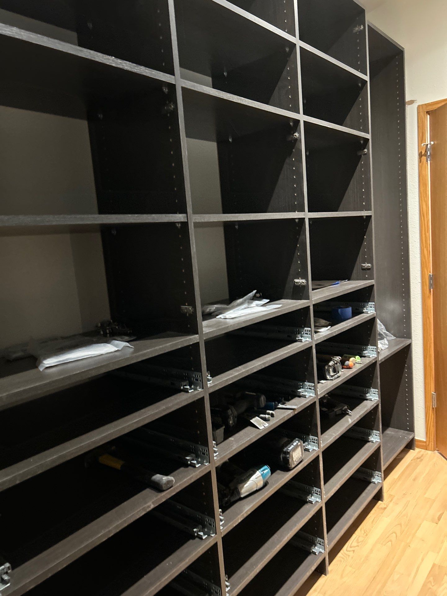Black Riftwood Primary Closet in Centennial by Concept 32, Inc.