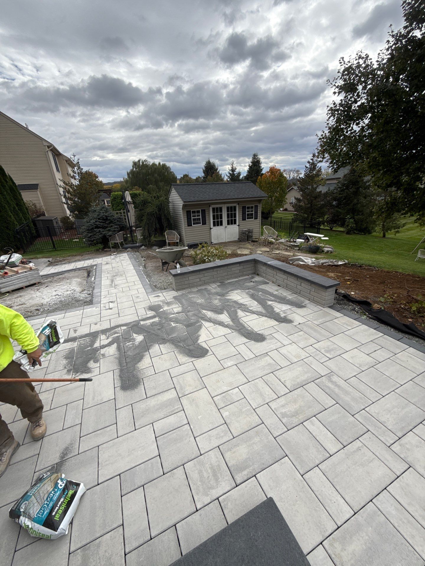 Backyard Retreat: Techo-Bloc Patio + Firepit Lounge by Saylor’s Lawn & Landscape