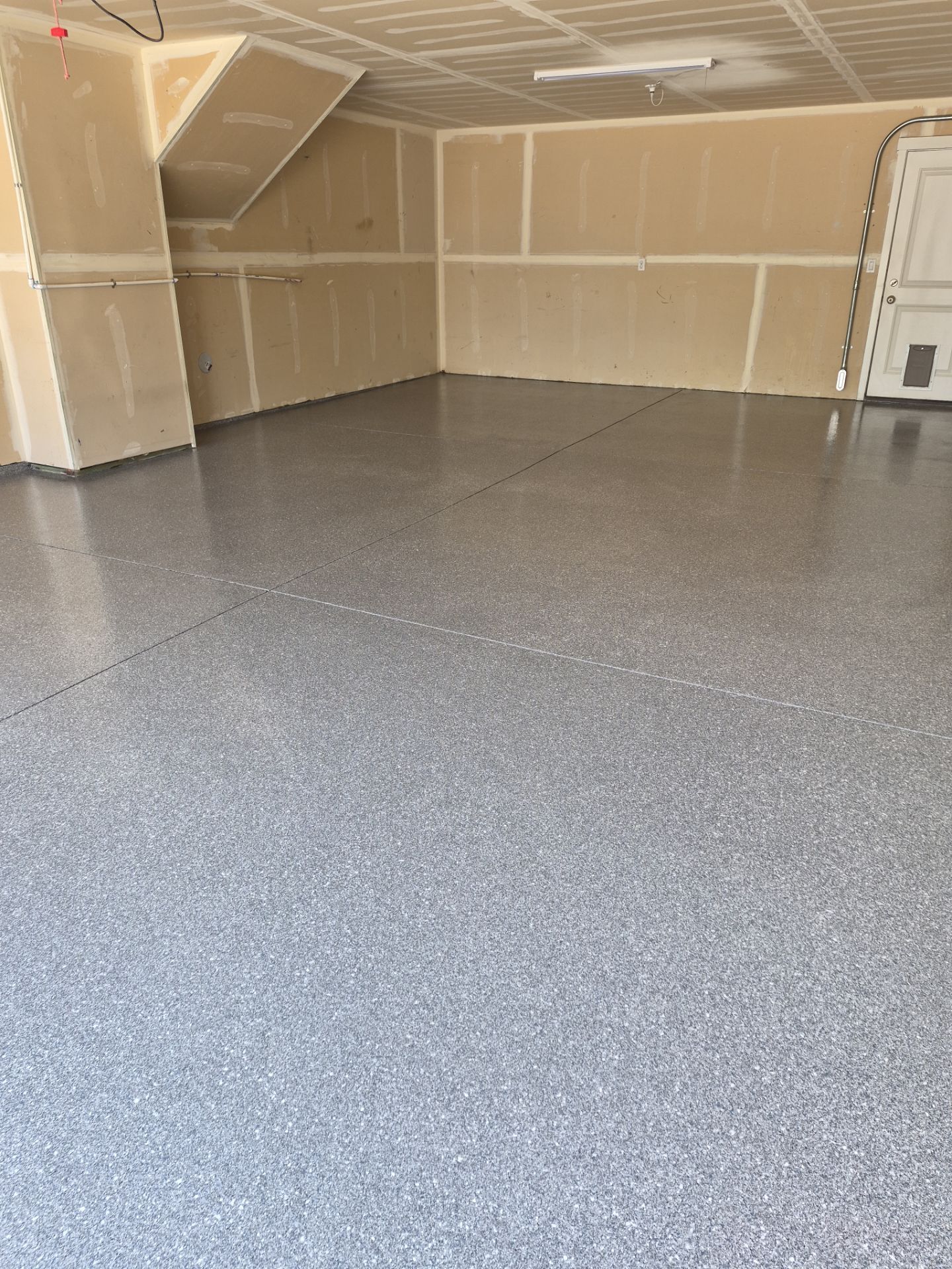 Garage Floor Coating Installation in Post Falls with Canfield Hybrid Flakes by Croc Coatings, LLC