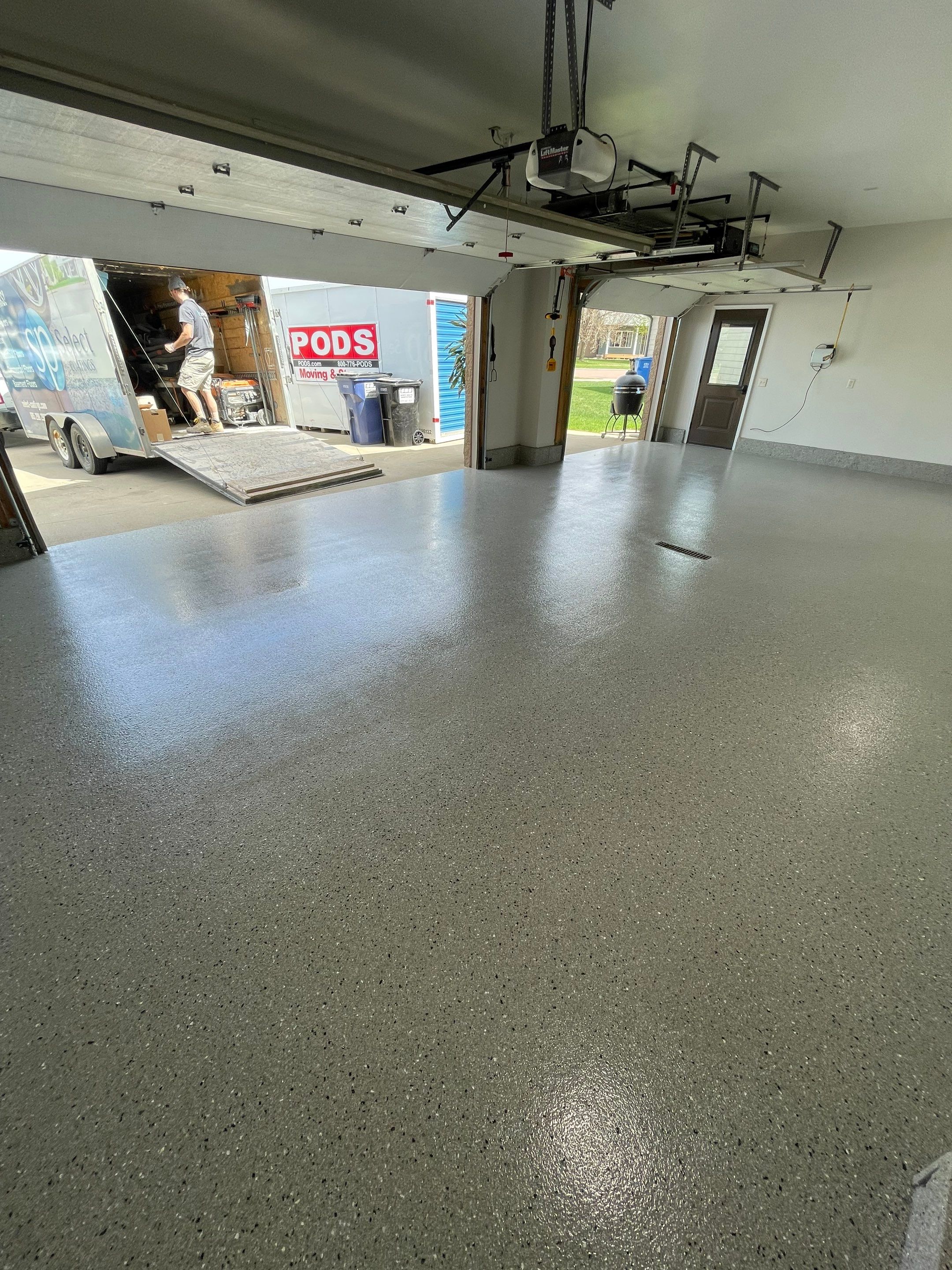 Residential Garage Floor Coating with Grey Speckled Epoxy Finish by Select Painting, Coatings & Garage Cabinets