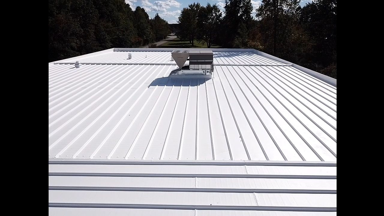 Commercial Metal Roof Coating by Gold Star Roofing LLC