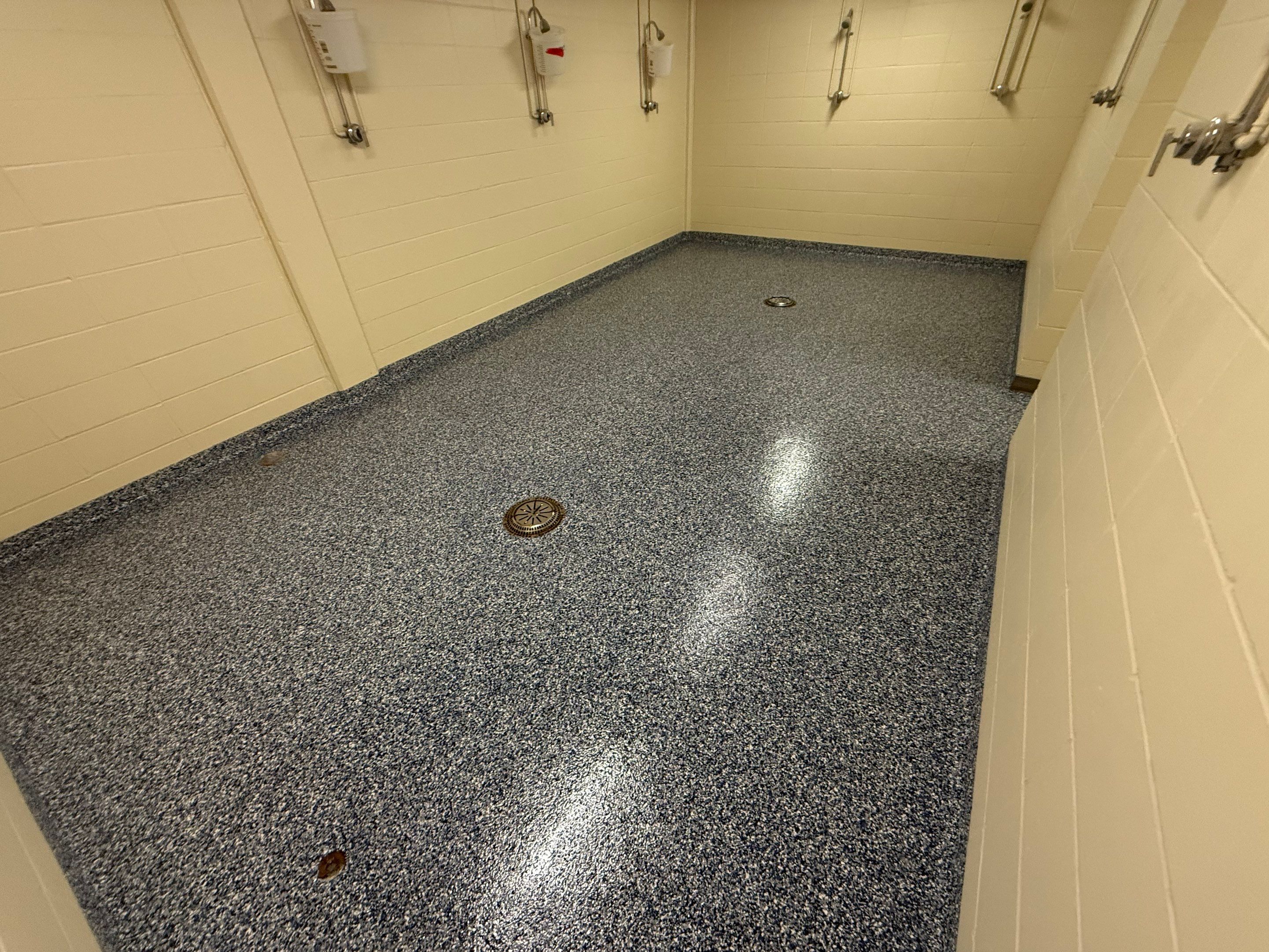 Seamless Epoxy Floor Coating at the Sioux Falls Canaries Facility by Select Painting, Coatings & Garage Cabinets
