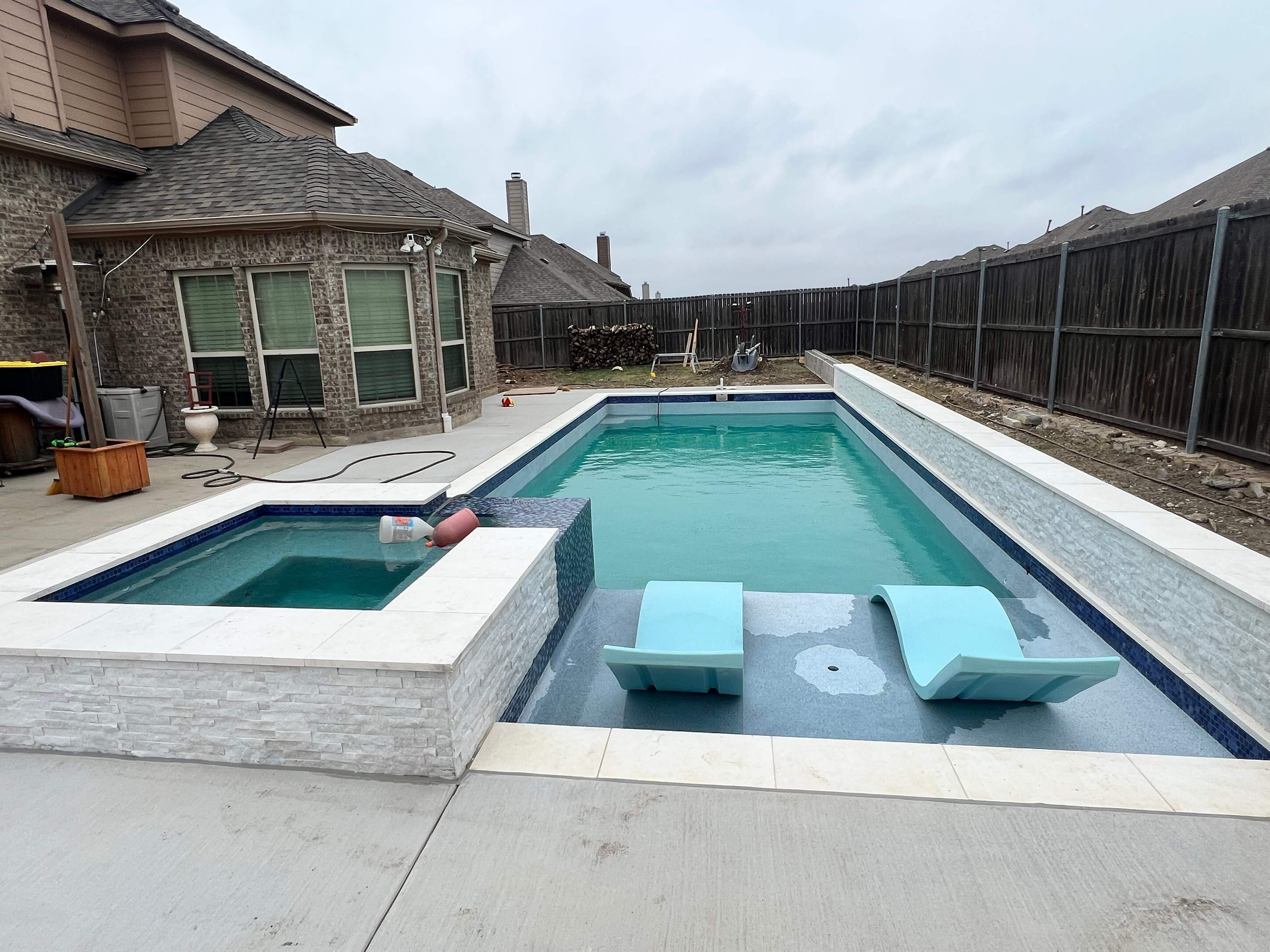 Geometric Pool with Raised Spa and Sun Shelf by Pinnacle Pools and Spas - DFW