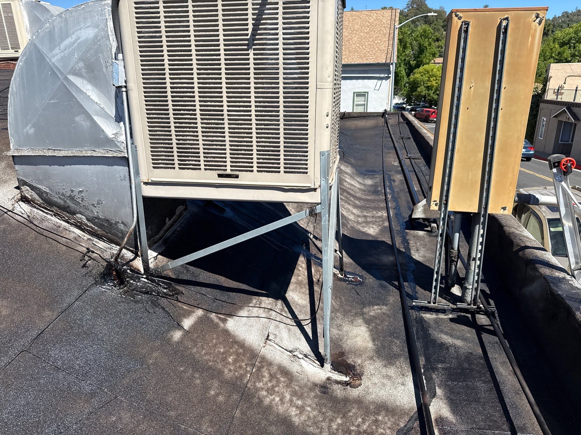 Foam and coatings on commercial roof by Straight Edge Roofing Inc