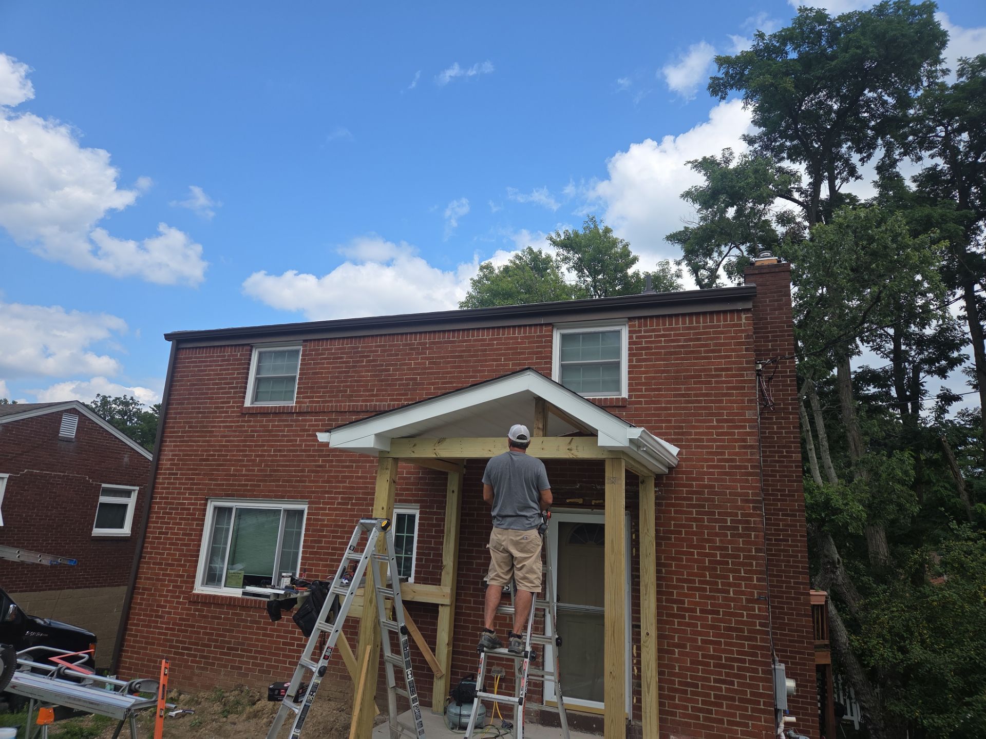 Concret and roof build  by Cousins Roofing Siding & Decks