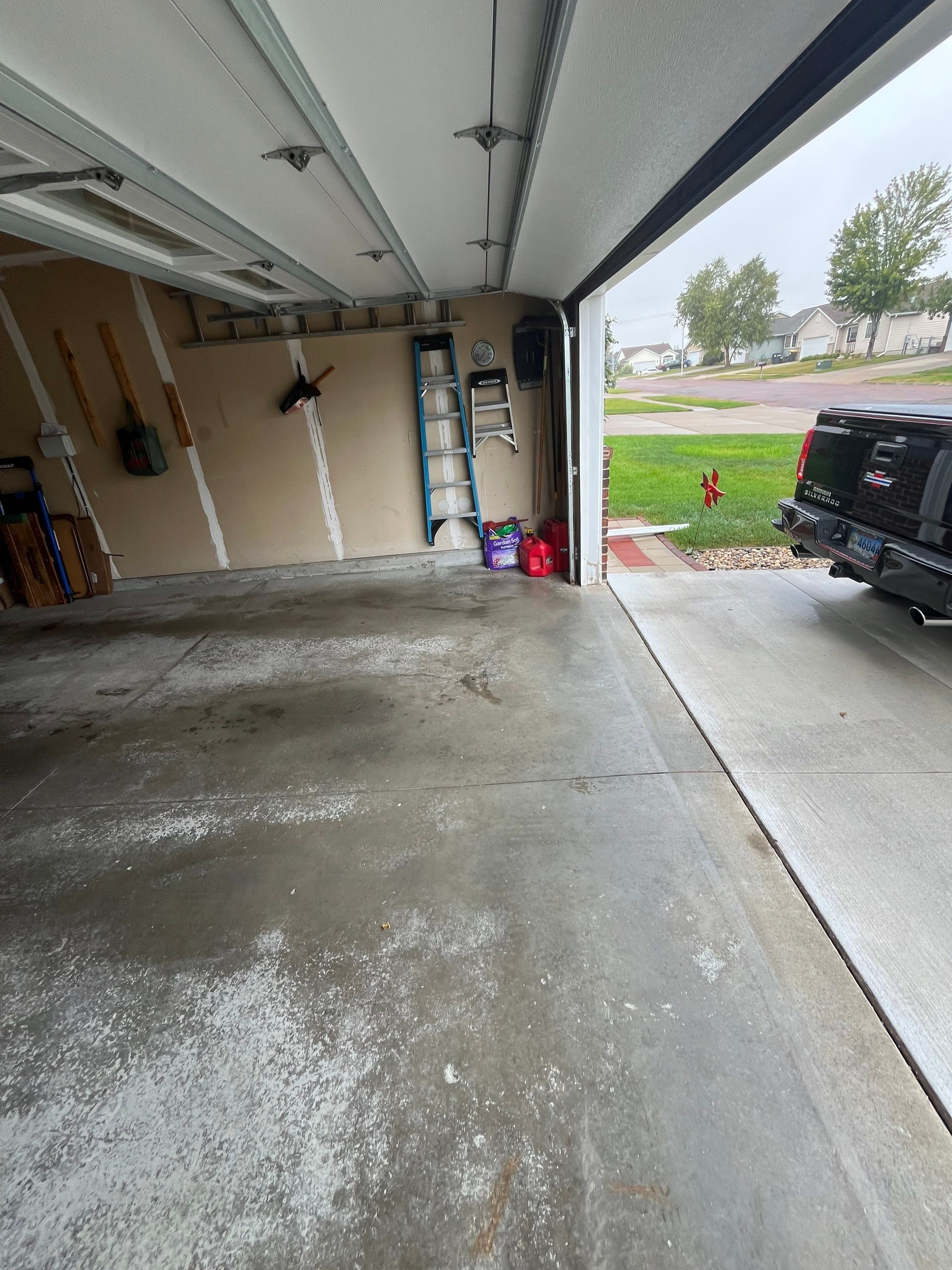 Nightfall Grey Speckled Epoxy Garage Floor Coating in Sioux Falls by Select Painting, Coatings & Garage Cabinets
