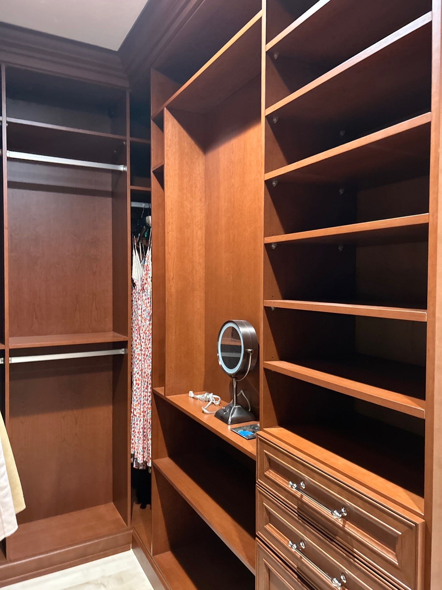 Stained Cherry Wood Primary Closet by Concept 32, Inc.