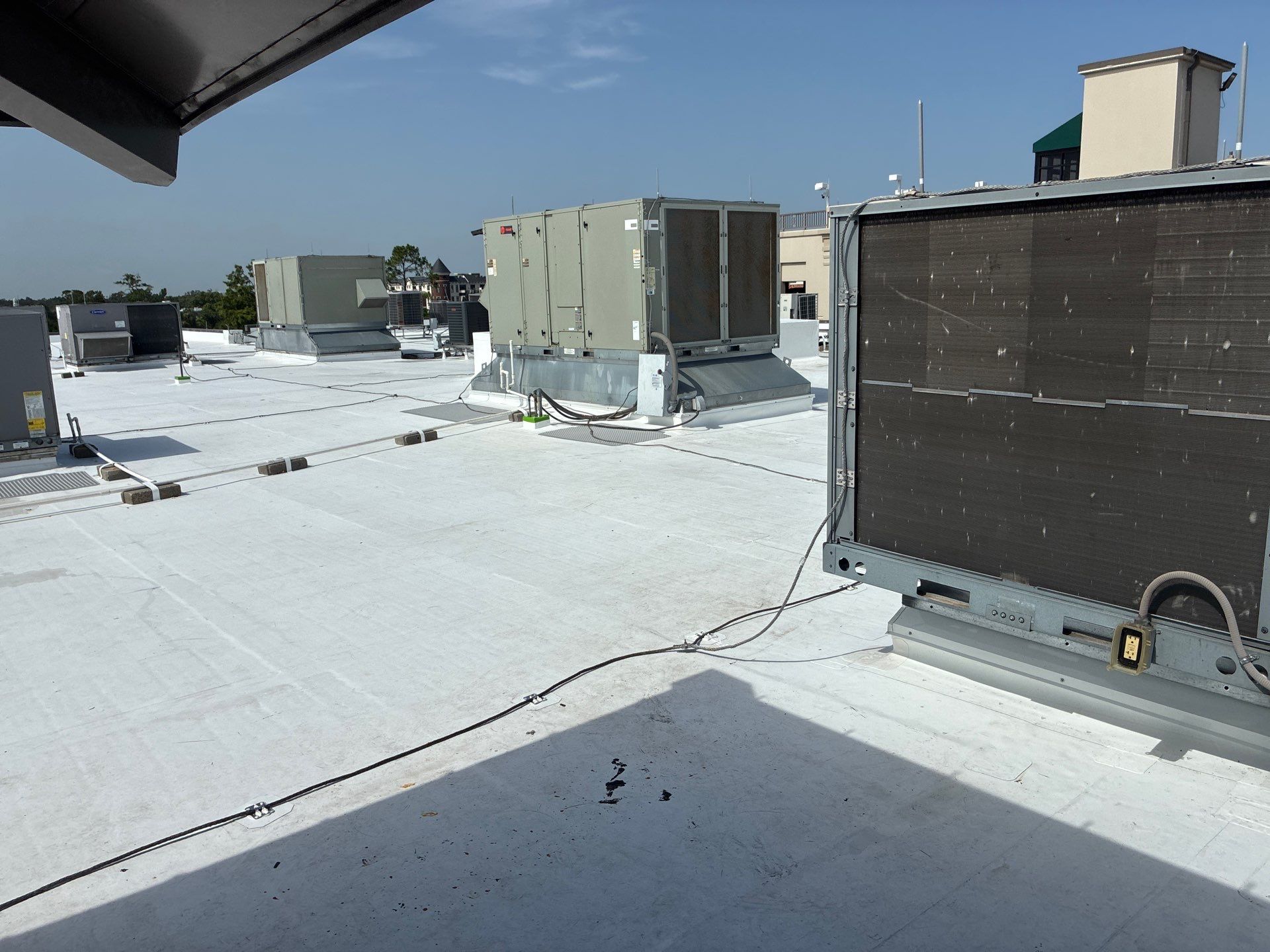 Commercial Flat Roof Installation with White Membrane in Winter Park