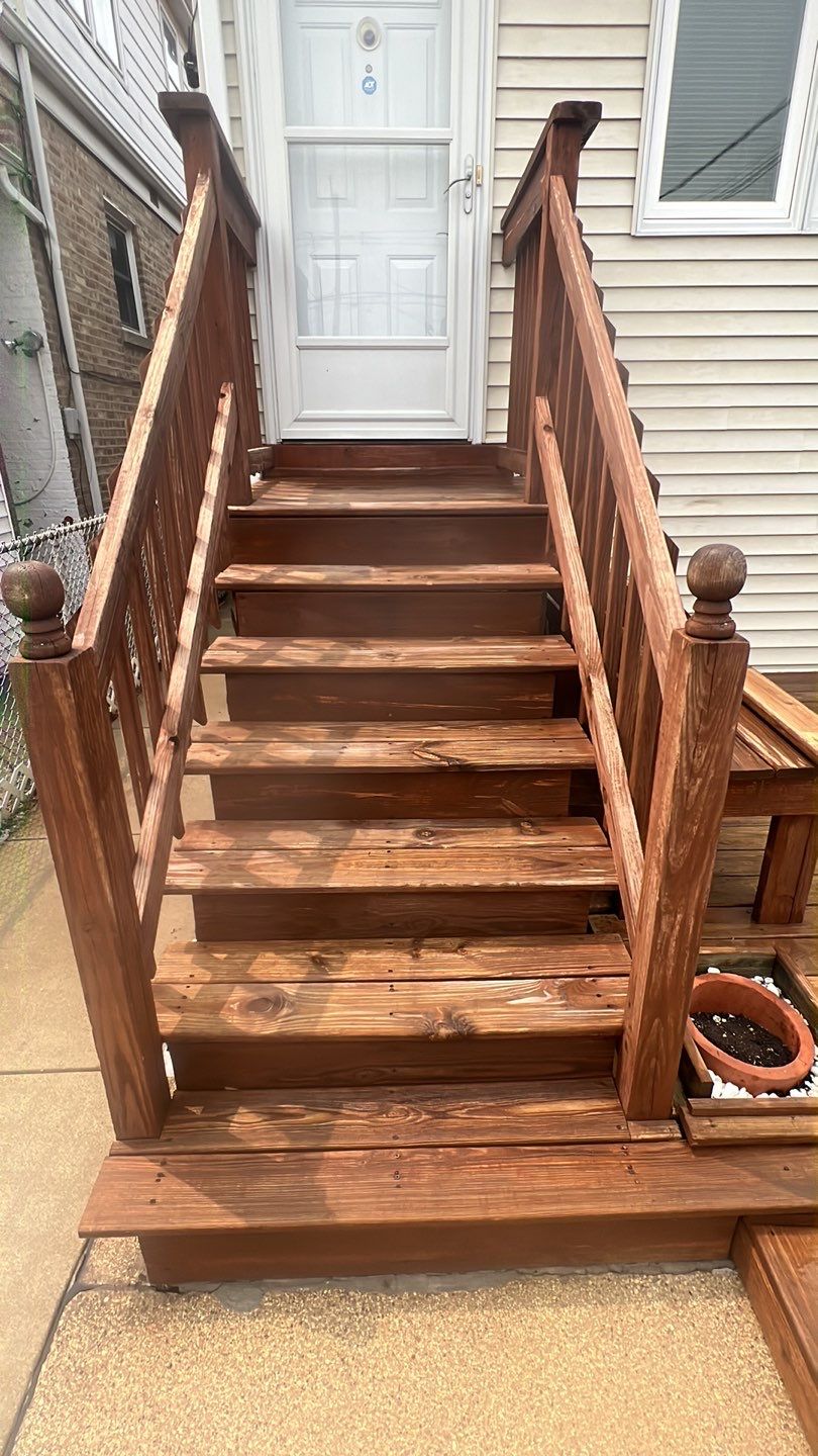 Wood cleaning and staining using Armstrong cloark oil stain by Northern Power Washing LLC.