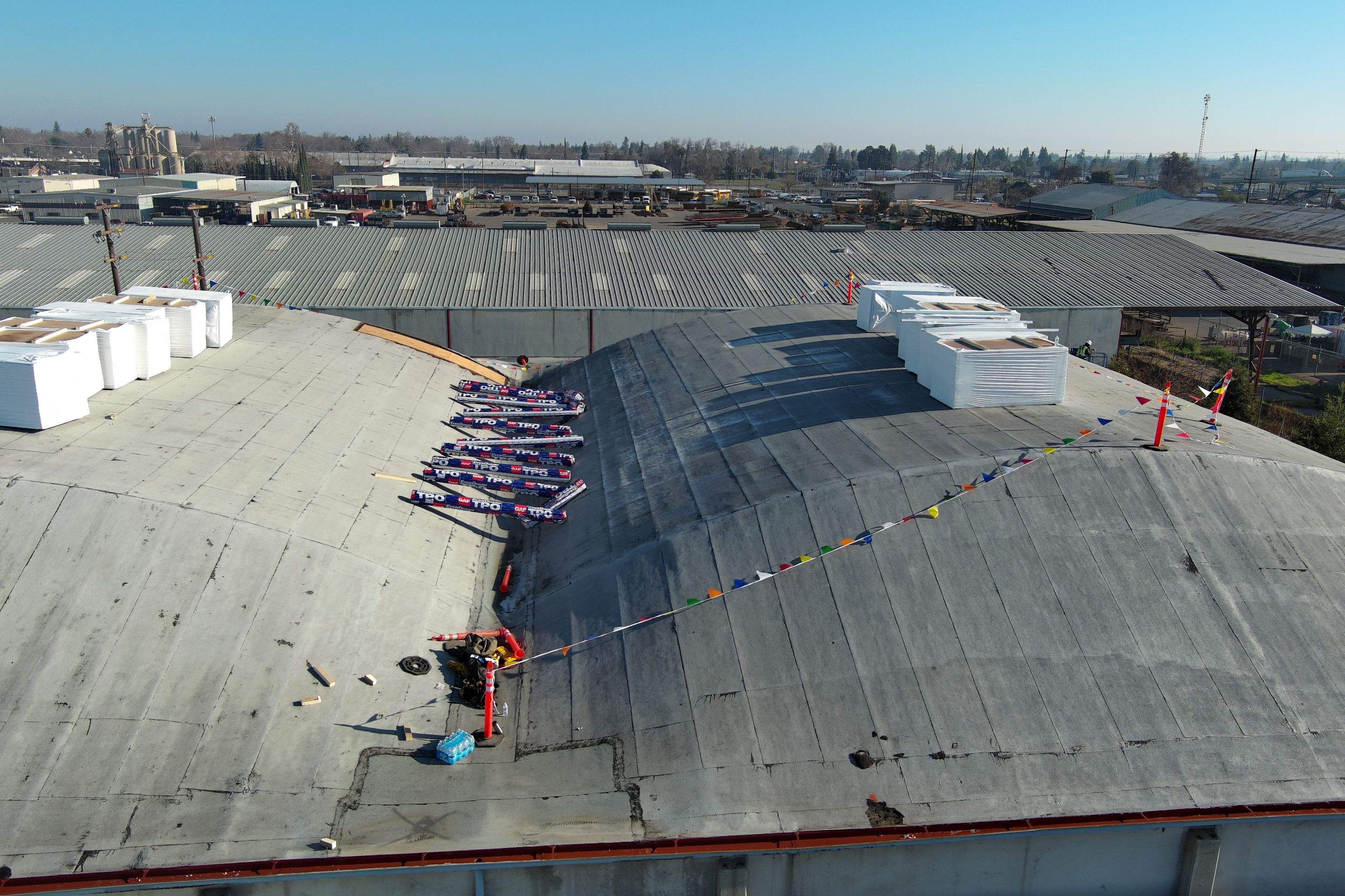 TPO single-ply roofing system using GAF Single-ply TPO 60 mil with 1.5 inch ISO board insulation by Straight Edge Roofing Inc