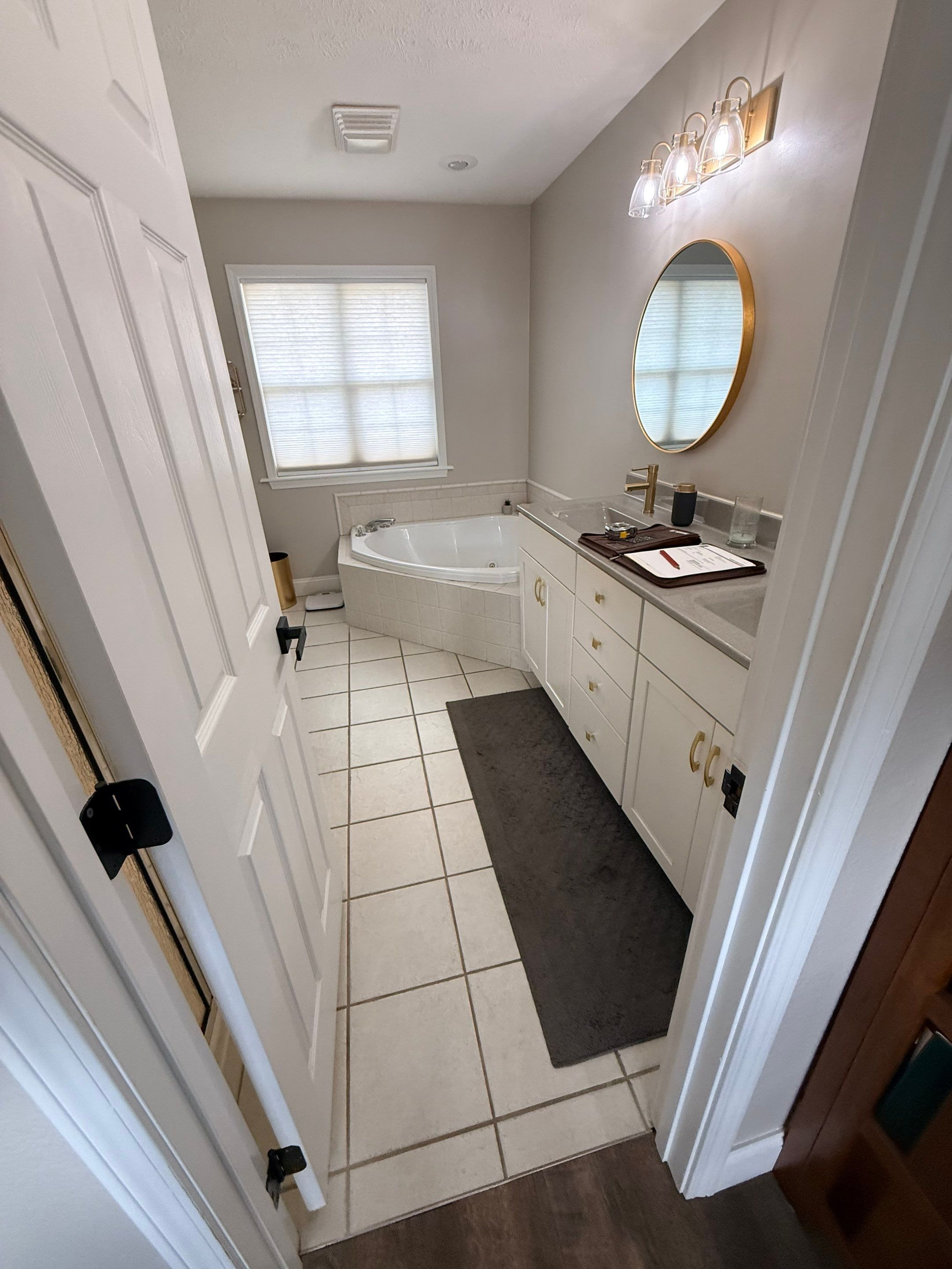 Master Bathroom Renovation Featuring Dark Textured Shower Panels in Branson West by Kitchen Works LLC