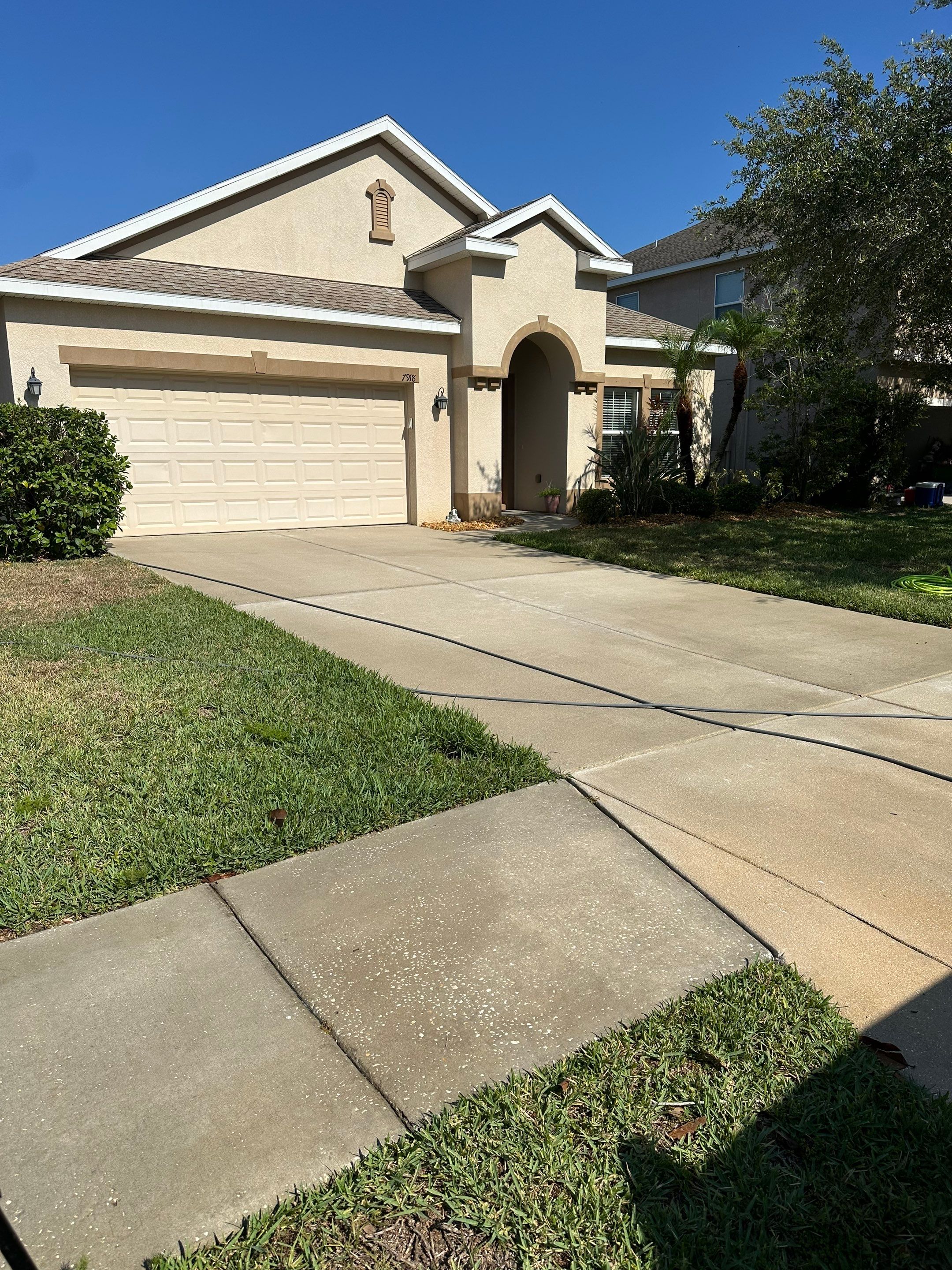 Asphalt Shingle Roof Soft Wash Cleaning & Concrete Pressure Washing in CopperStone Community, Parrish, FL by Sunshine AquaWash