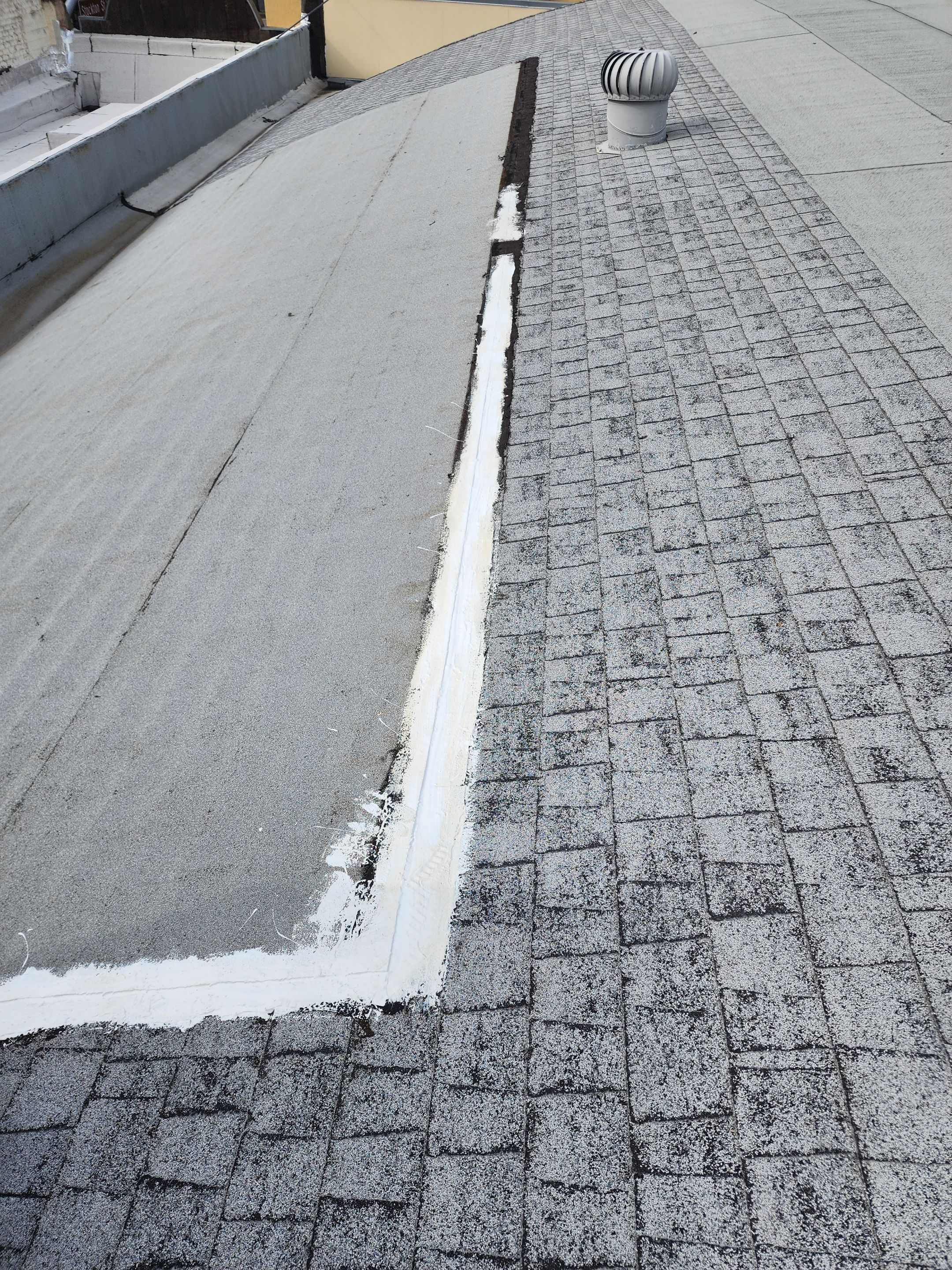 Foam and coatings on commercial roof by Straight Edge Roofing Inc