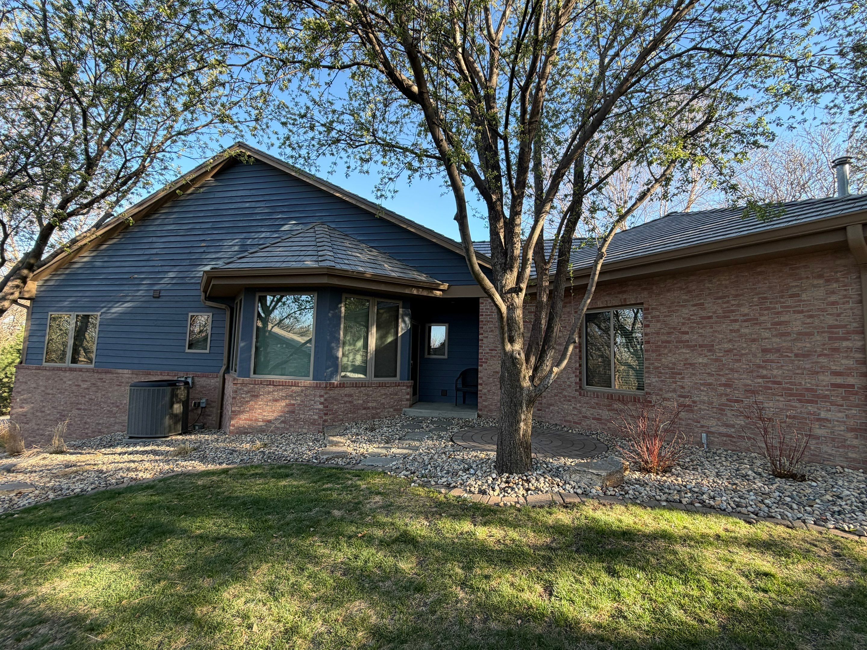 Residential Exterior Painting and Siding Refresh in Sioux Falls by Select Painting, Coatings & Garage Cabinets