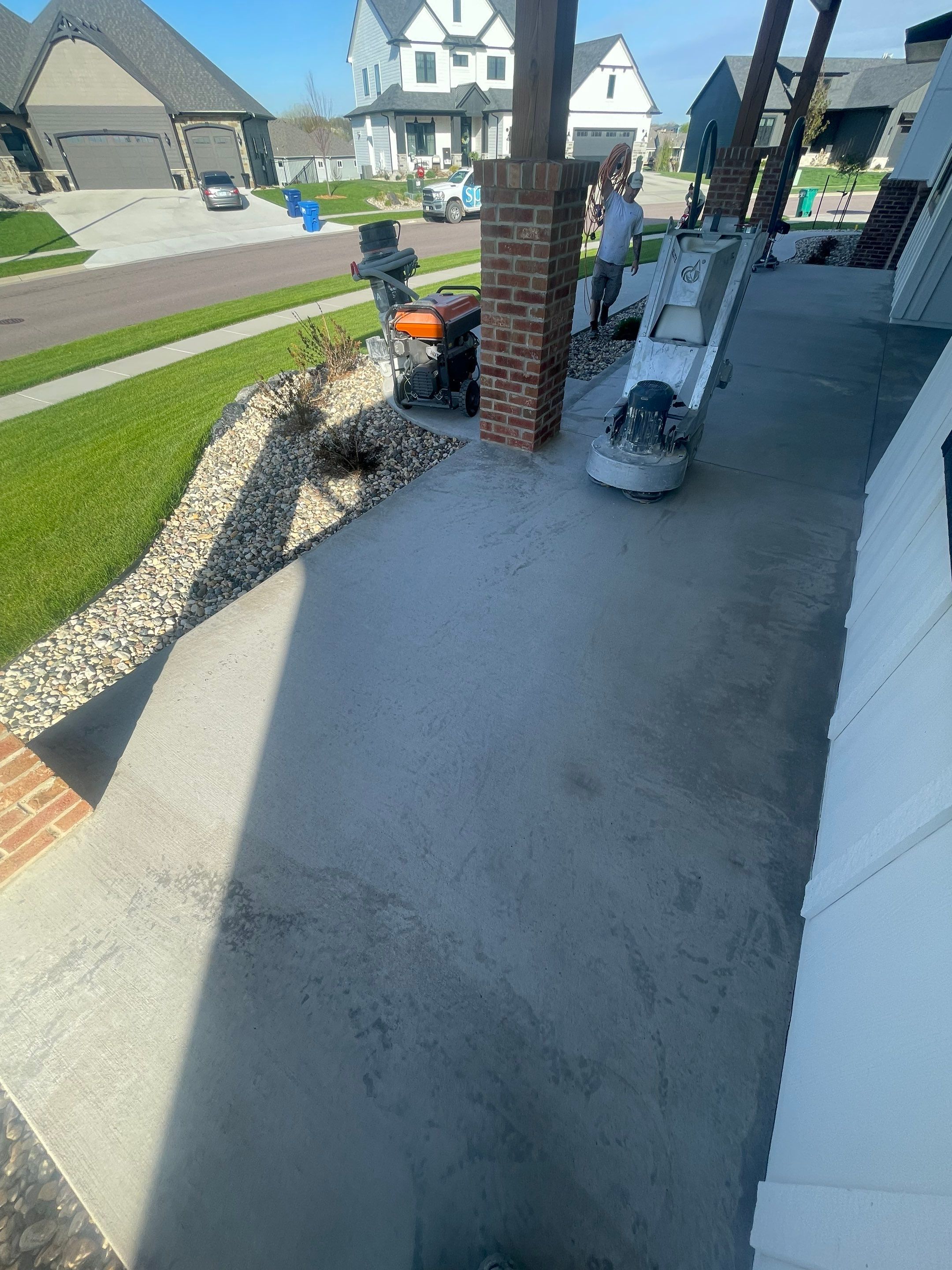 Grey Speckled Concrete Porch Coating for Sioux Falls Home by Select Painting, Coatings & Garage Cabinets
