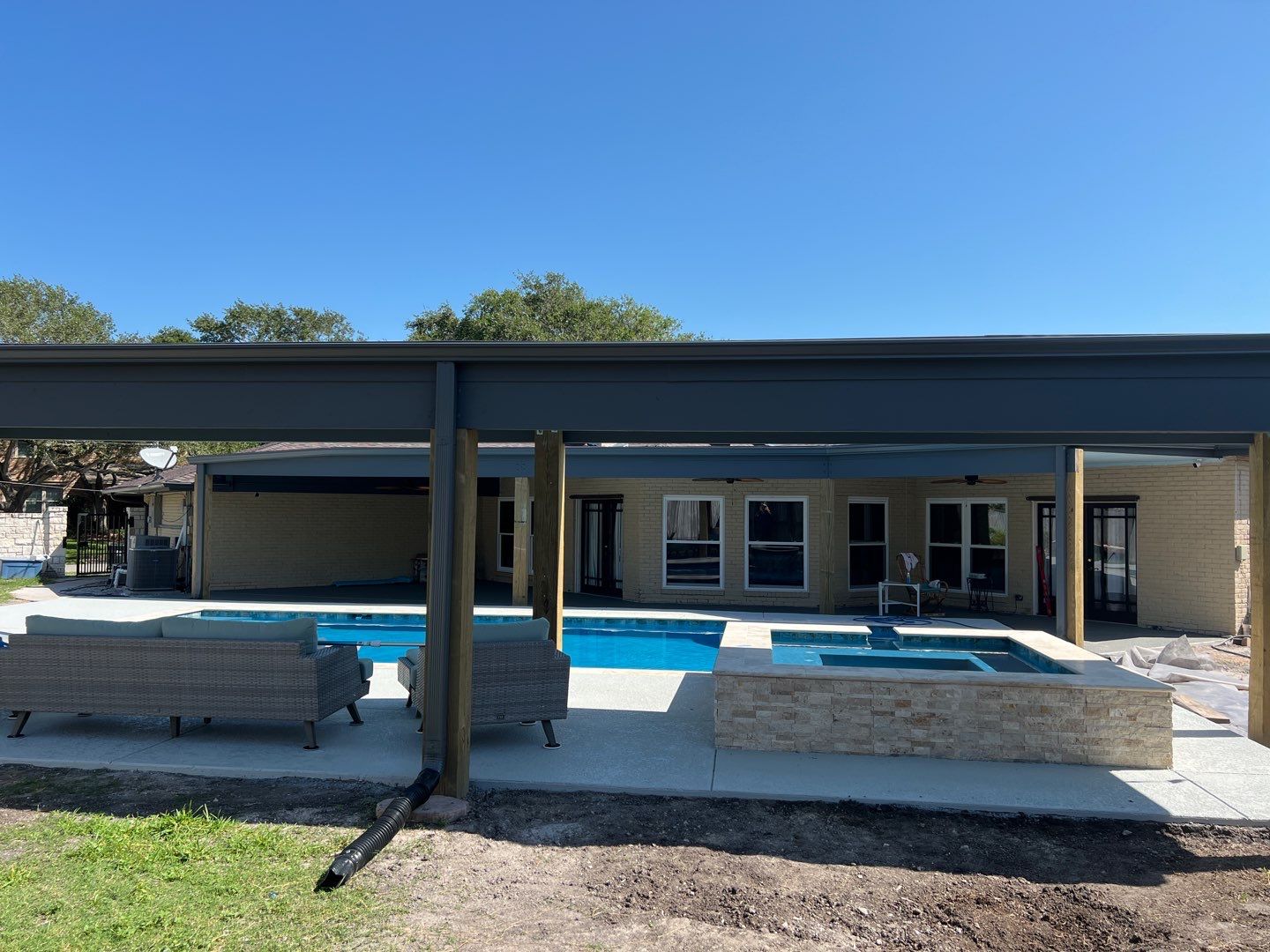 Beautiful pool side build by Bayfront Roofing and Construction