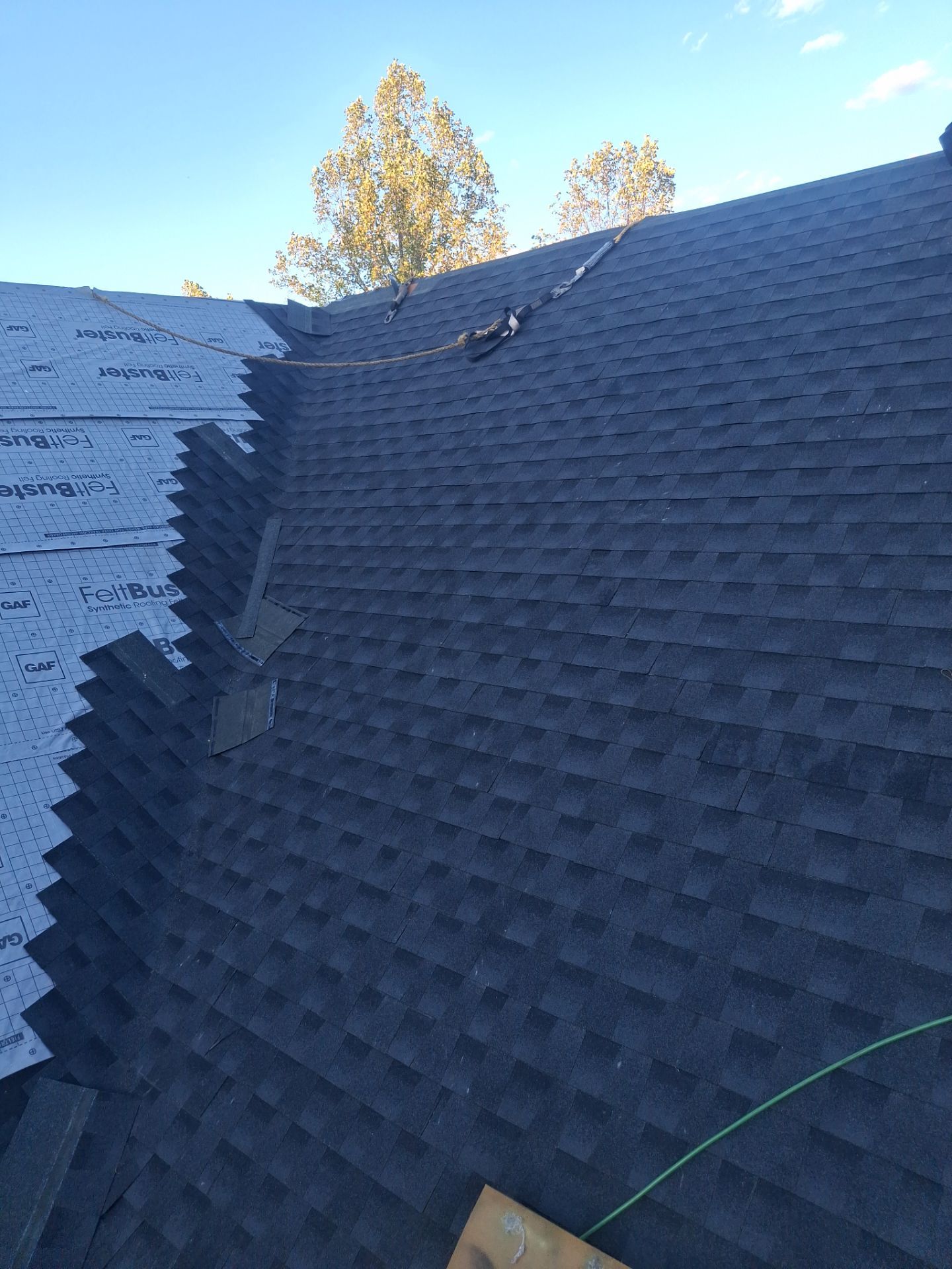 Residential Roofing Installation using GAF Timberline HDZ Charcoal by Rainstoppers Roofing