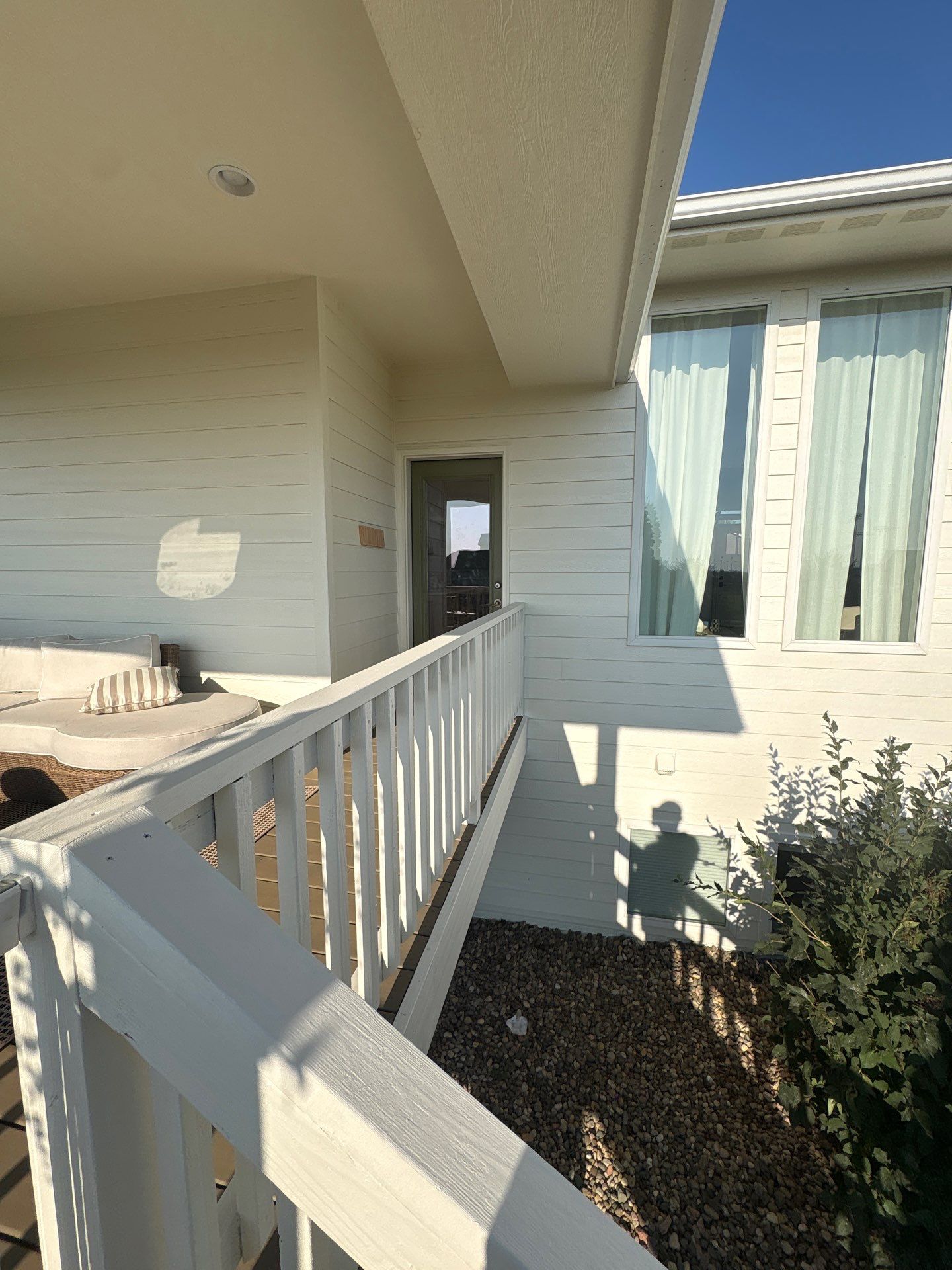 Sioux Falls Exterior Residential Siding and Deck Painting Project by Select Painting, Coatings & Garage Cabinets