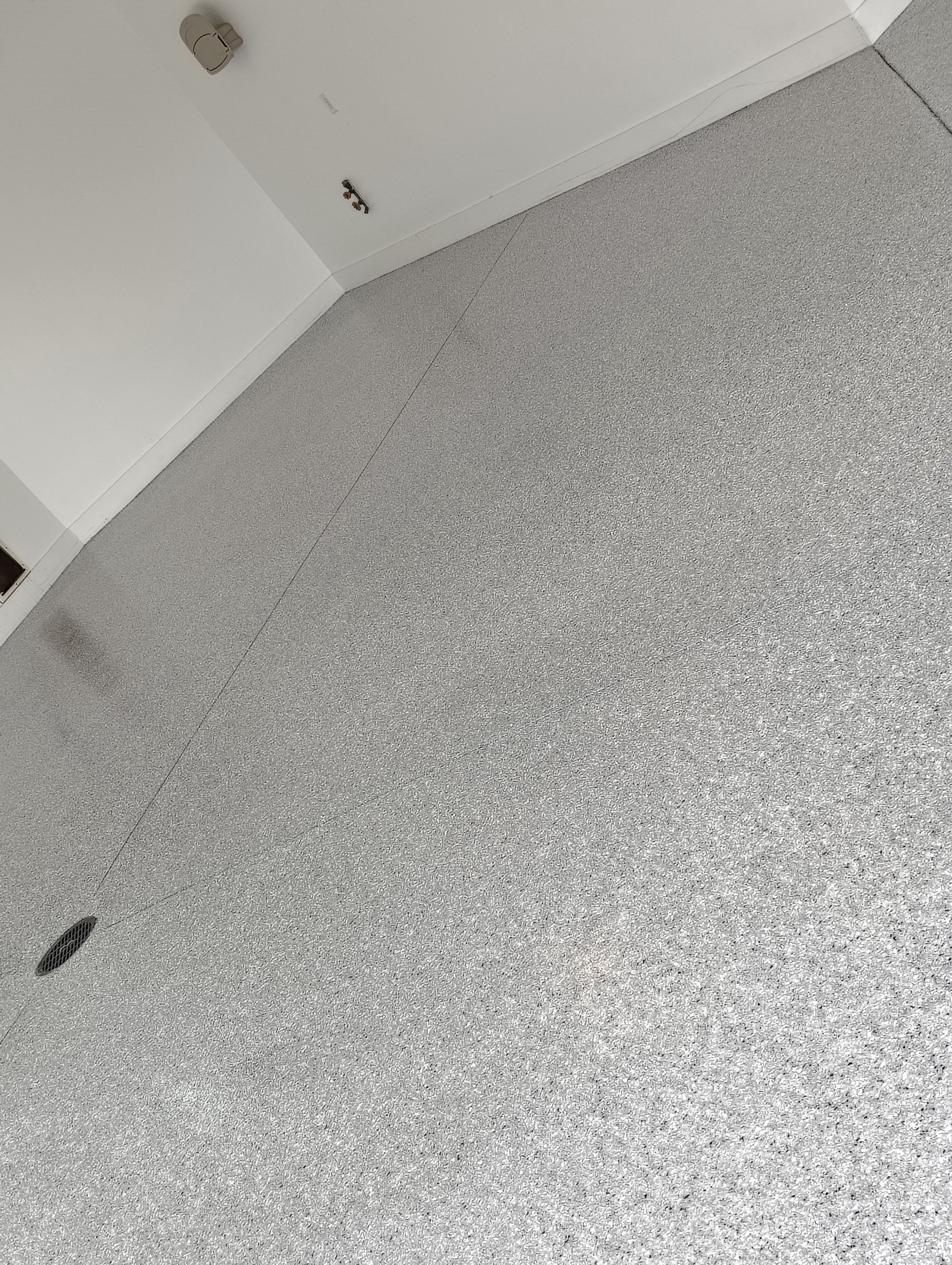 Feather Grey Floor Coating in Sioux Falls, SD by Select Painting, Coatings & Garage Cabinets