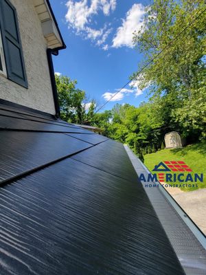 Tesla Solar Roof, Powerwall, and Black Gutters
