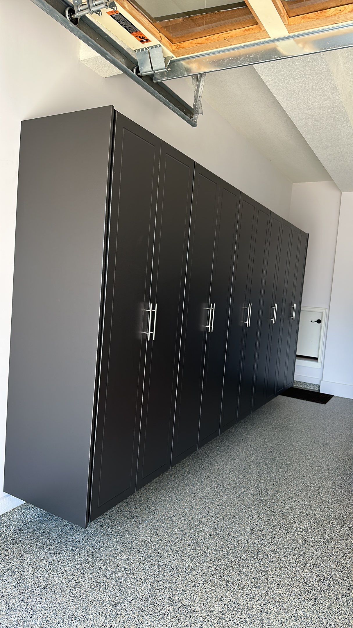 Lori H. upgrade her garage with cabinets and overhead racks by Banner Garage