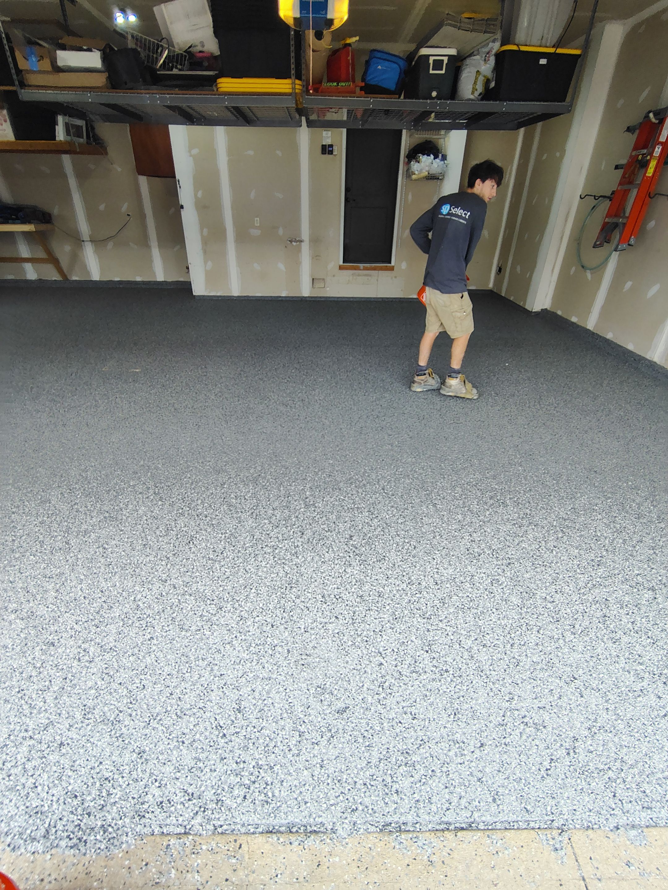 Sioux Falls Garage Concrete Grinding and Nightfall Decorative Chip Coating by Select Painting, Coatings & Garage Cabinets