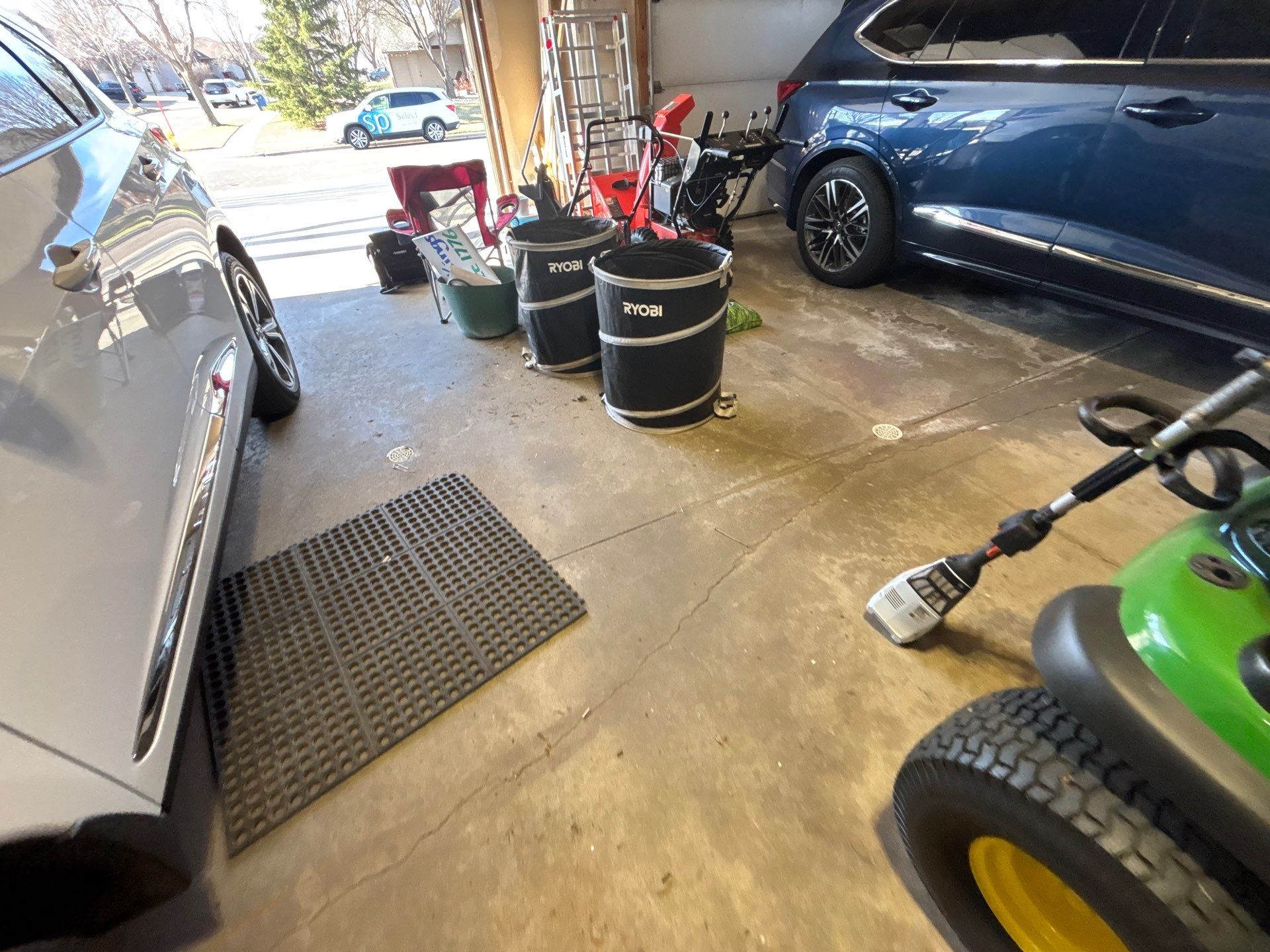 Sioux Falls Garage Concrete Repair and Epoxy Flake Floor Coating by Select Painting, Coatings & Garage Cabinets