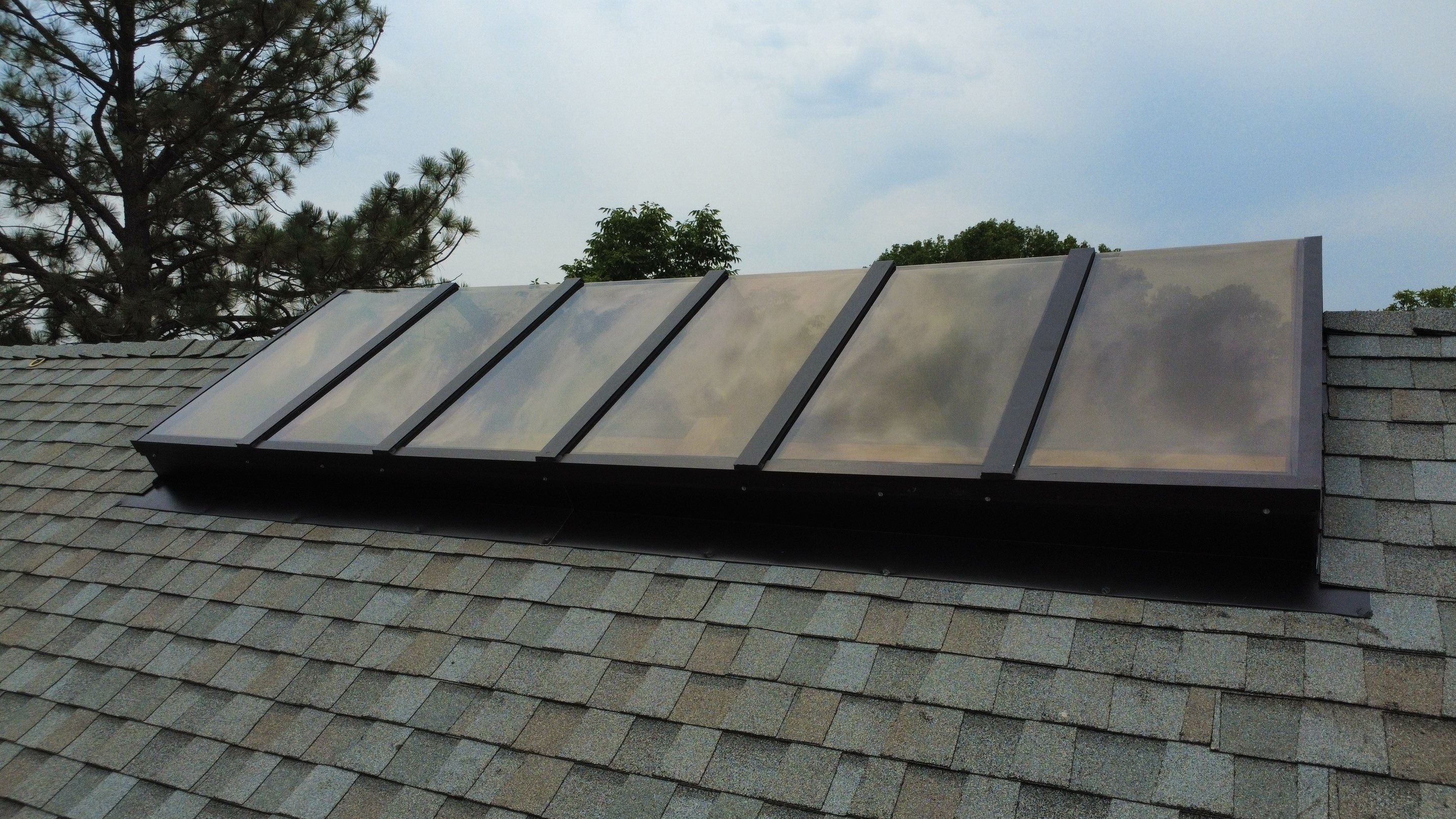 Asphalt Shingle and Skylight Replacement Project in Denver, CO by Blue Peaks Roofing LLC 
