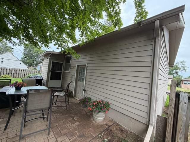 Dark Blue Exterior Painting and Trim Refresh in Sioux Falls by Select Painting, Coatings & Garage Cabinets
