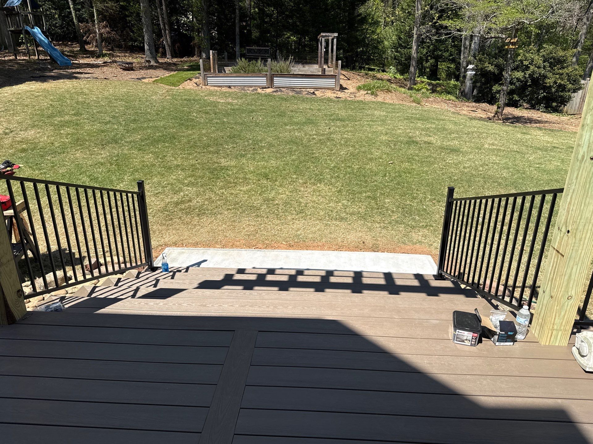 Marietta, GA Deck Replacement using Deckorators Venture Series Decking and Trex Steel Railing by Nelson Exteriors 