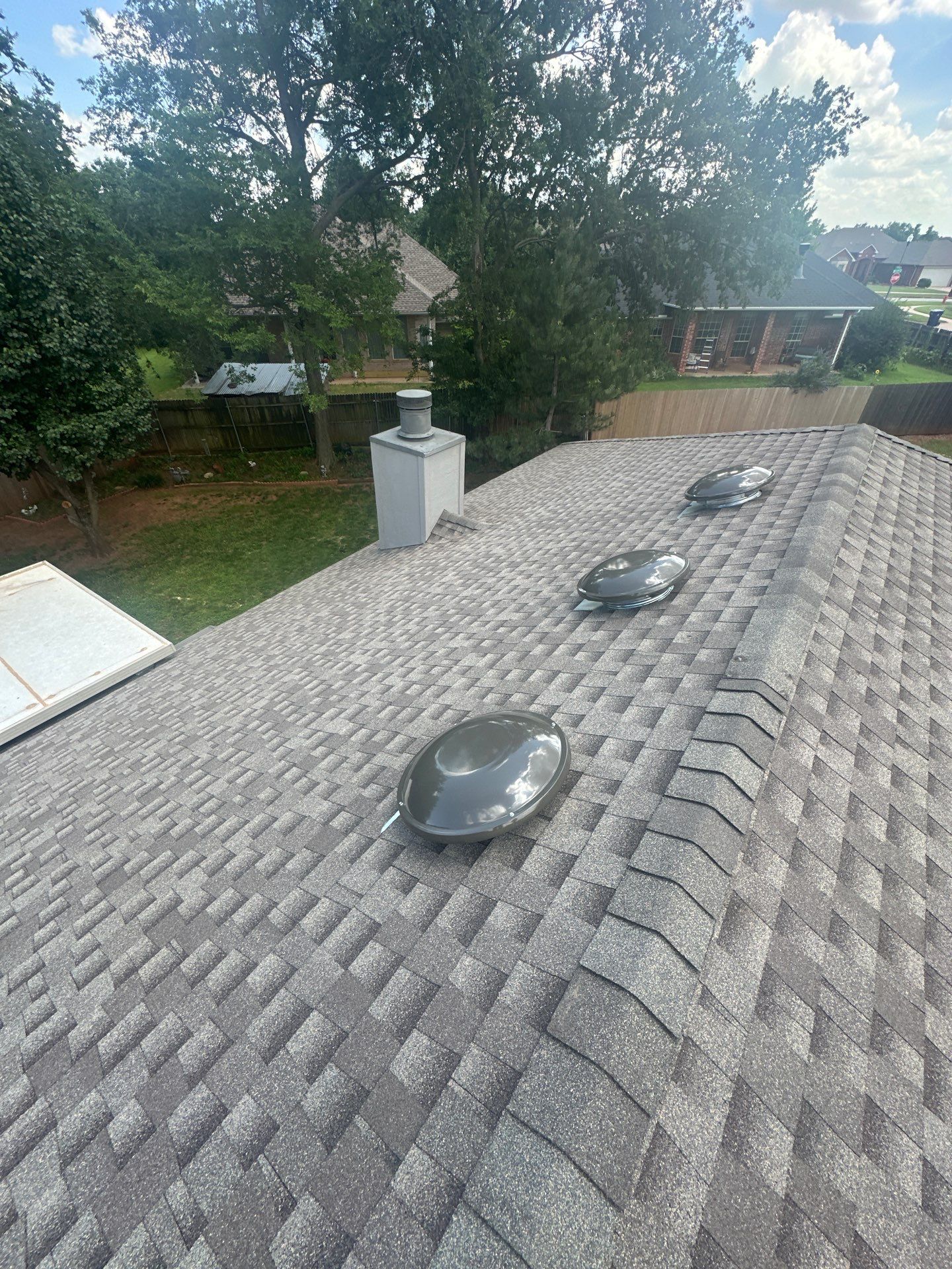 roof, chimney siding, & solar tube replacement in Edmond by McCann's Roofing and Construction