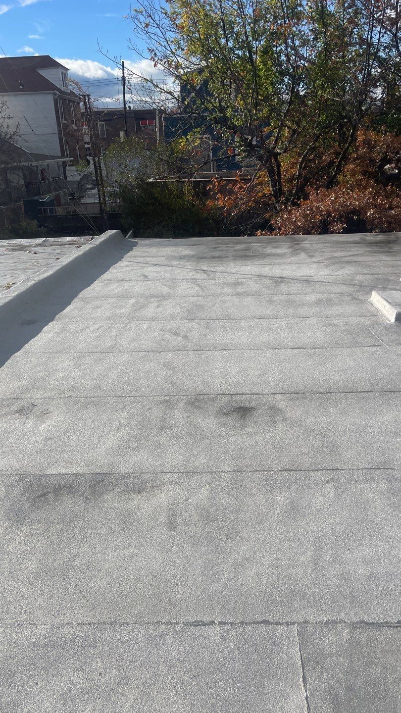 Flat Roof Cleanup and gutter cleaning.  by Above All Gutters 