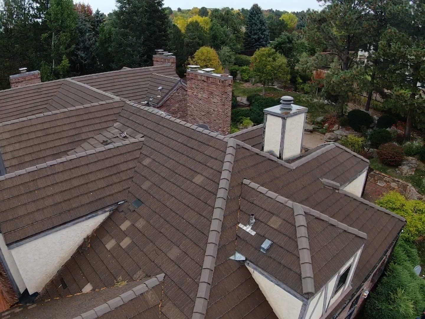 Unified Stone Coated Roof & Stucco Remodle by Blue Peaks Roofing LLC